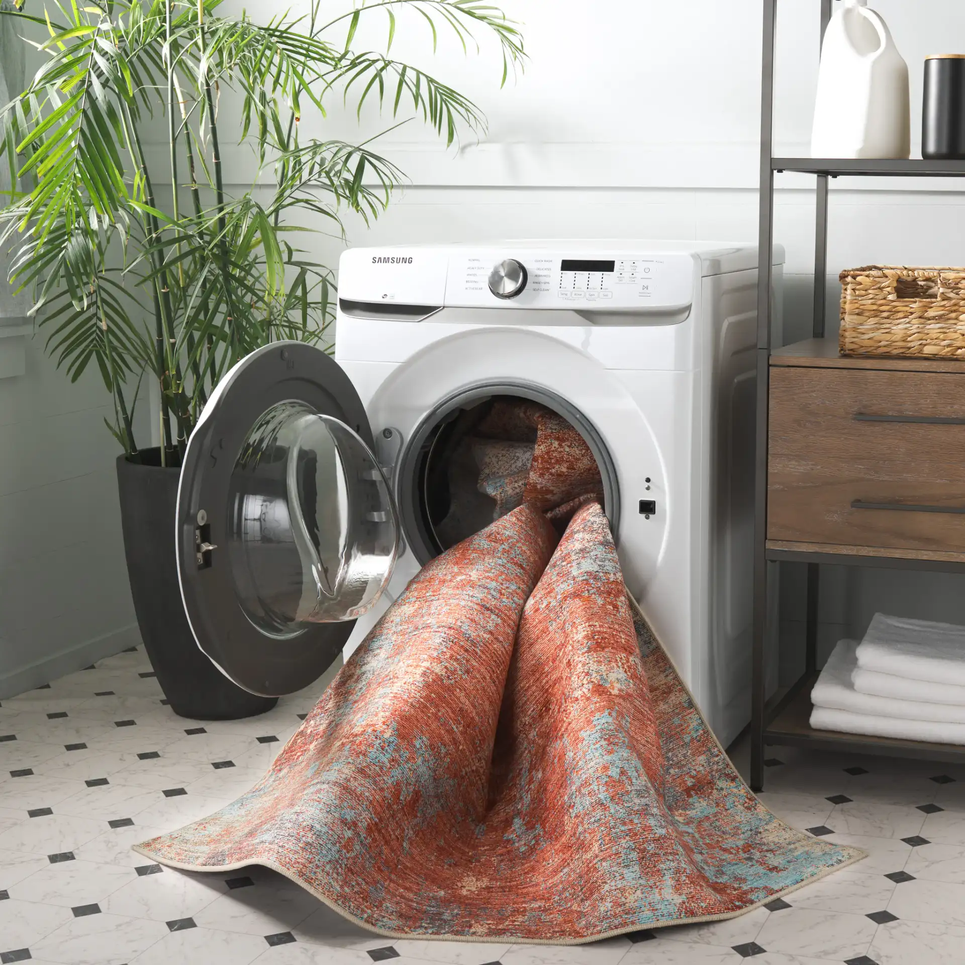Tacoma Abstract Washable Rug in Rust / Aqua in a styled room
