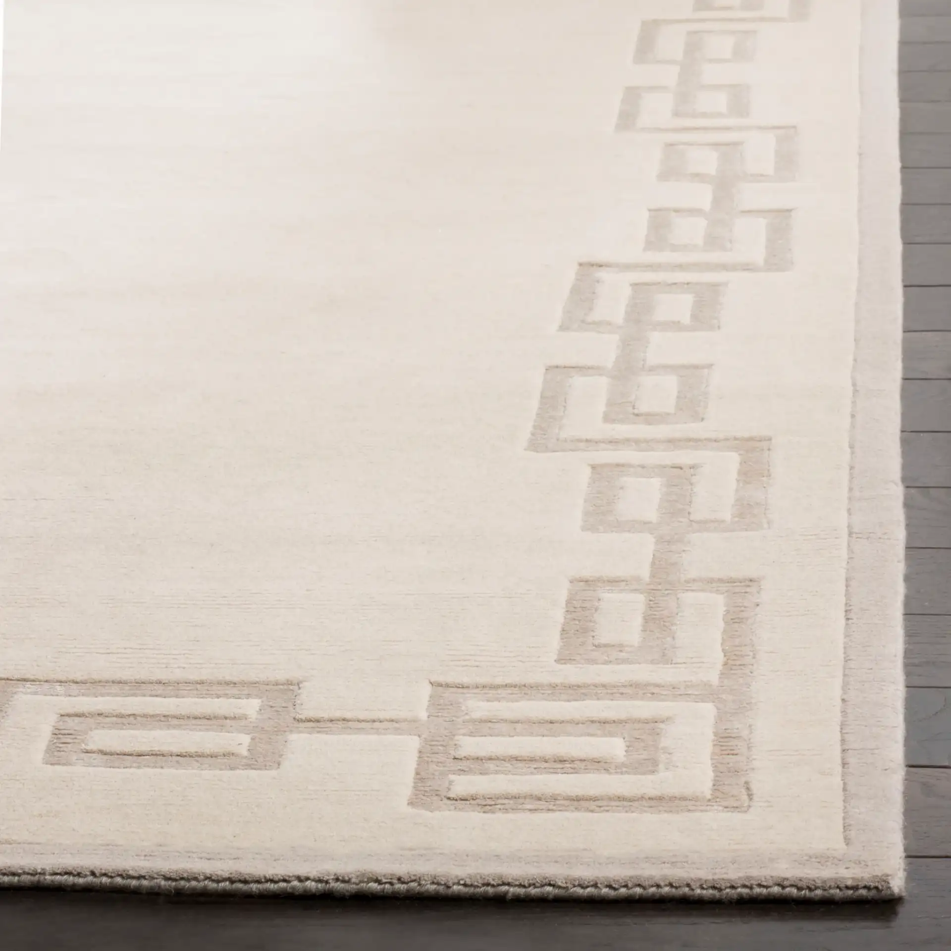 Tibetan Greek Key Open Field Hand-Knotted Wool Rug in Silver in a styled room