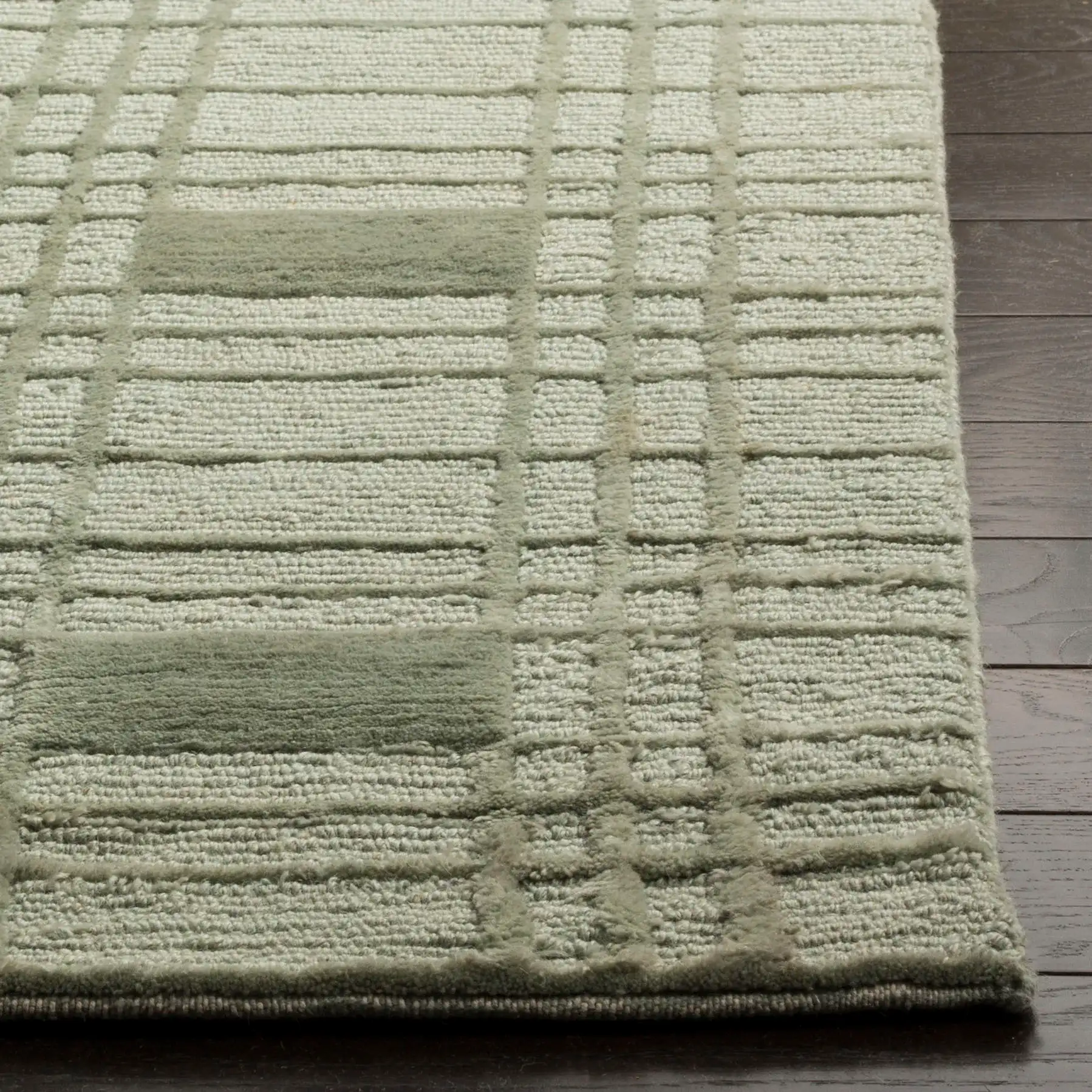 Tibetan Grid Hand-Knotted Wool Rug in Celadon in a styled room