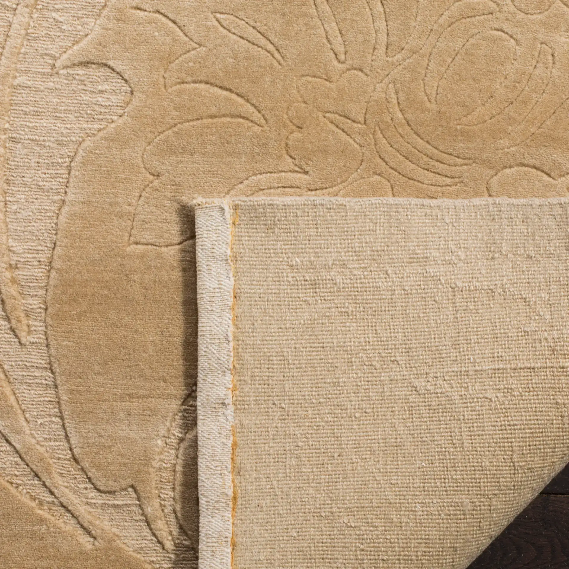 Tibetan Carved Floral Hand-Knotted Wool Rug in Cream in a styled room