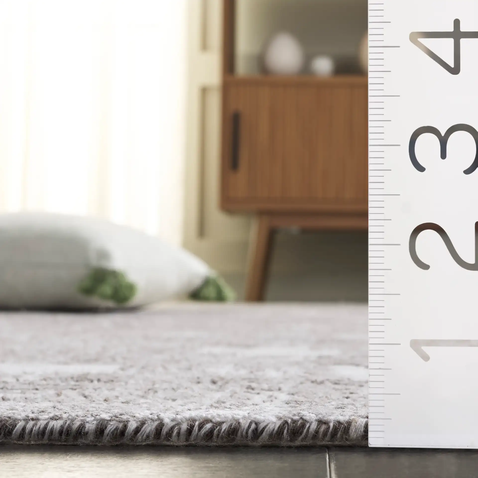 Tibetan Textured Grid Hand-Loomed Rug in Ivory / Gray in a styled room