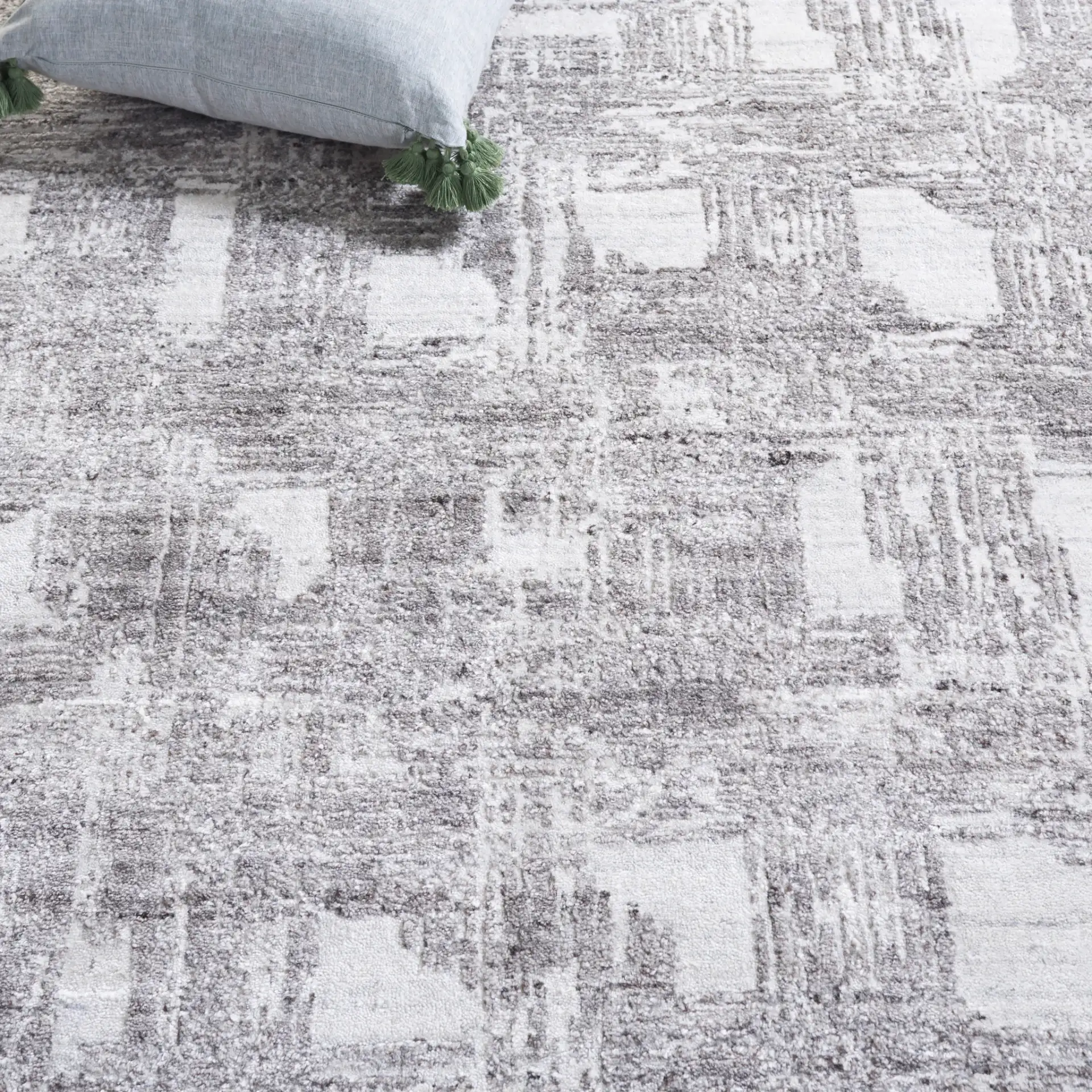 Tibetan Textured Grid Hand-Loomed Rug in Ivory / Gray in a styled room