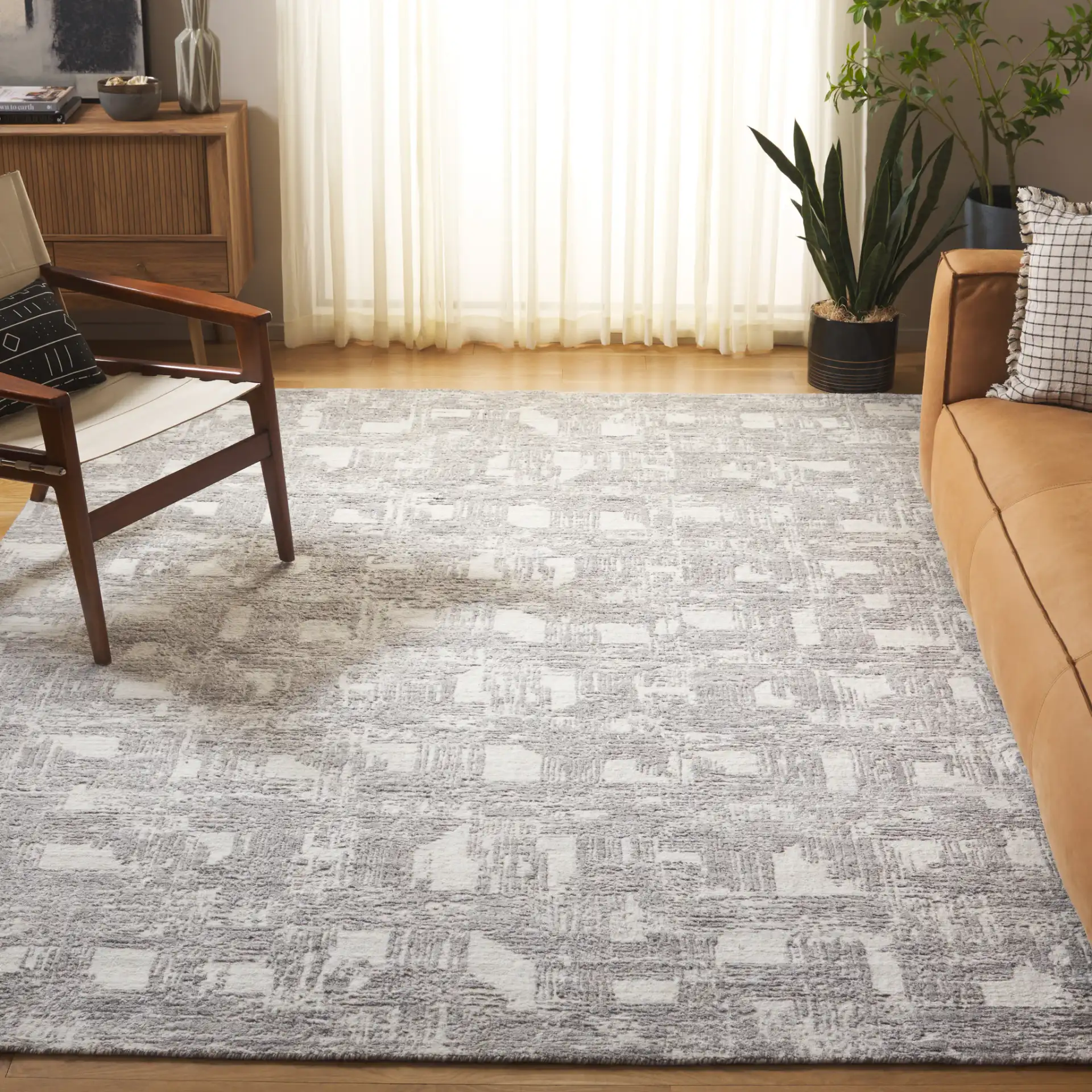 Tibetan Textured Grid Hand-Loomed Rug in Ivory / Gray in a styled room