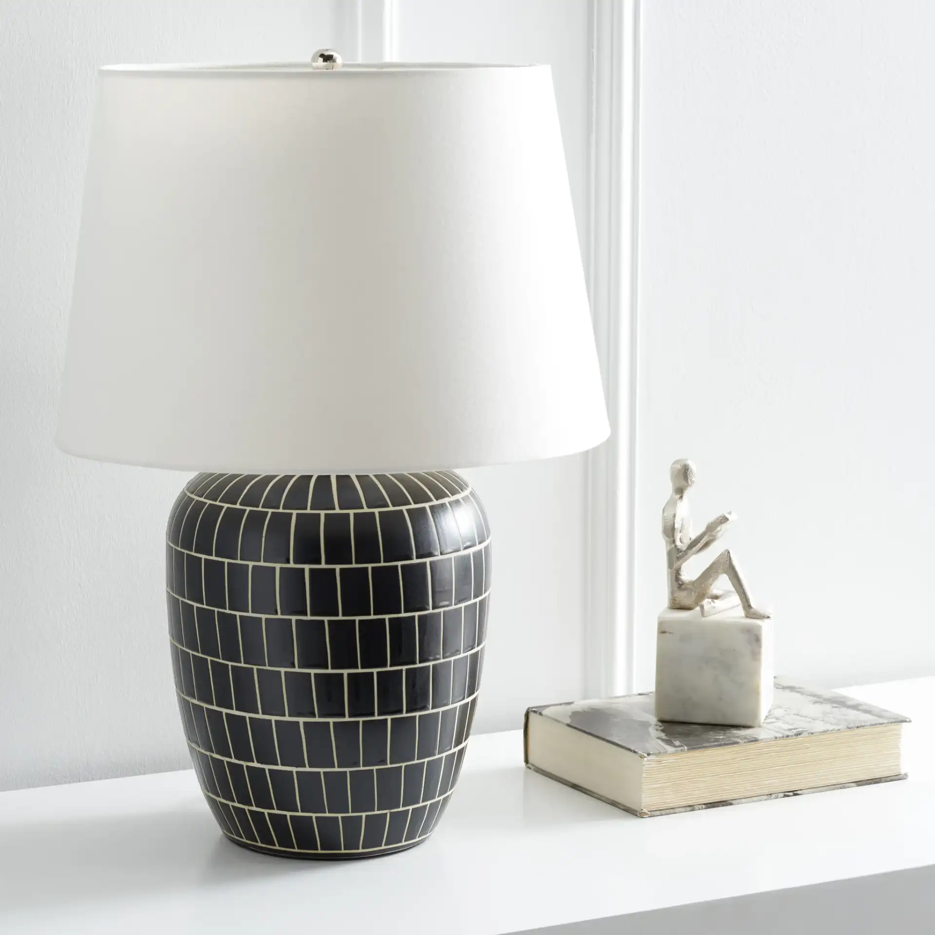 Aela Table Lamp in Black in a styled room