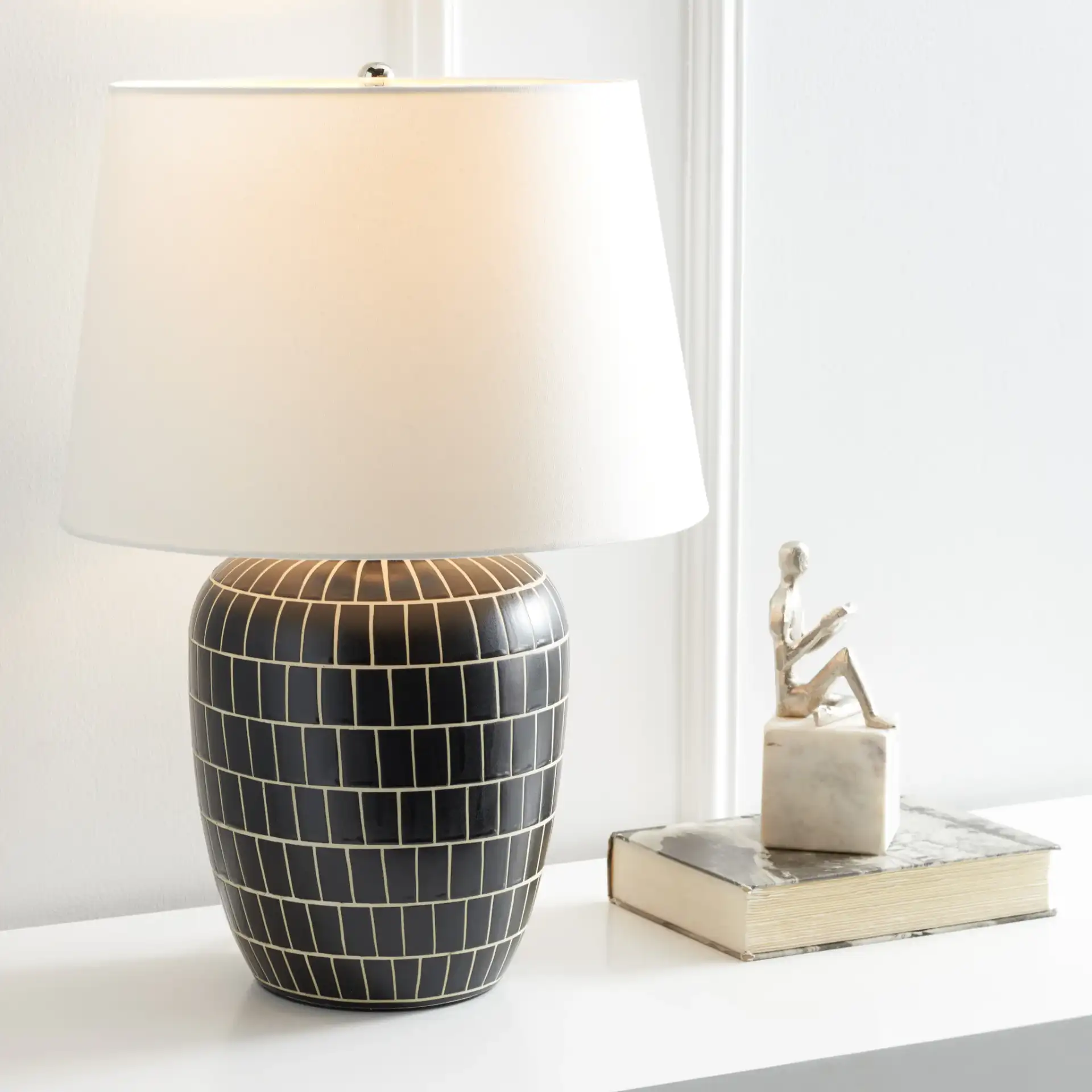 Aela Table Lamp in Black in a styled room