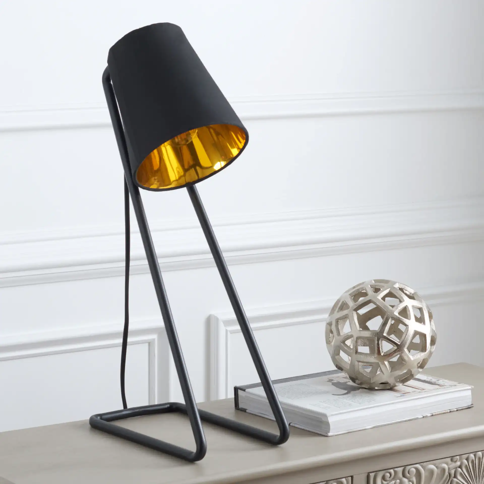 Guarnere Table Lamp in Black / Gold in a styled room