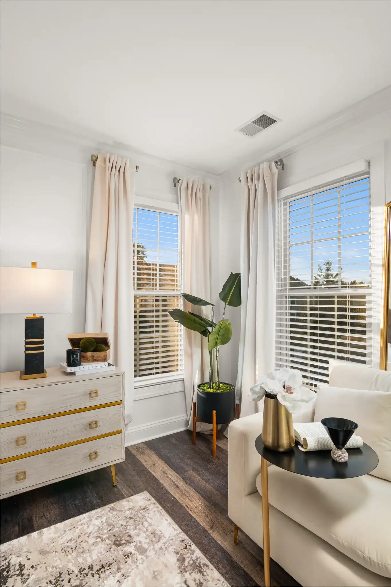 Jaxton Table Lamp in White / Gold in a styled room