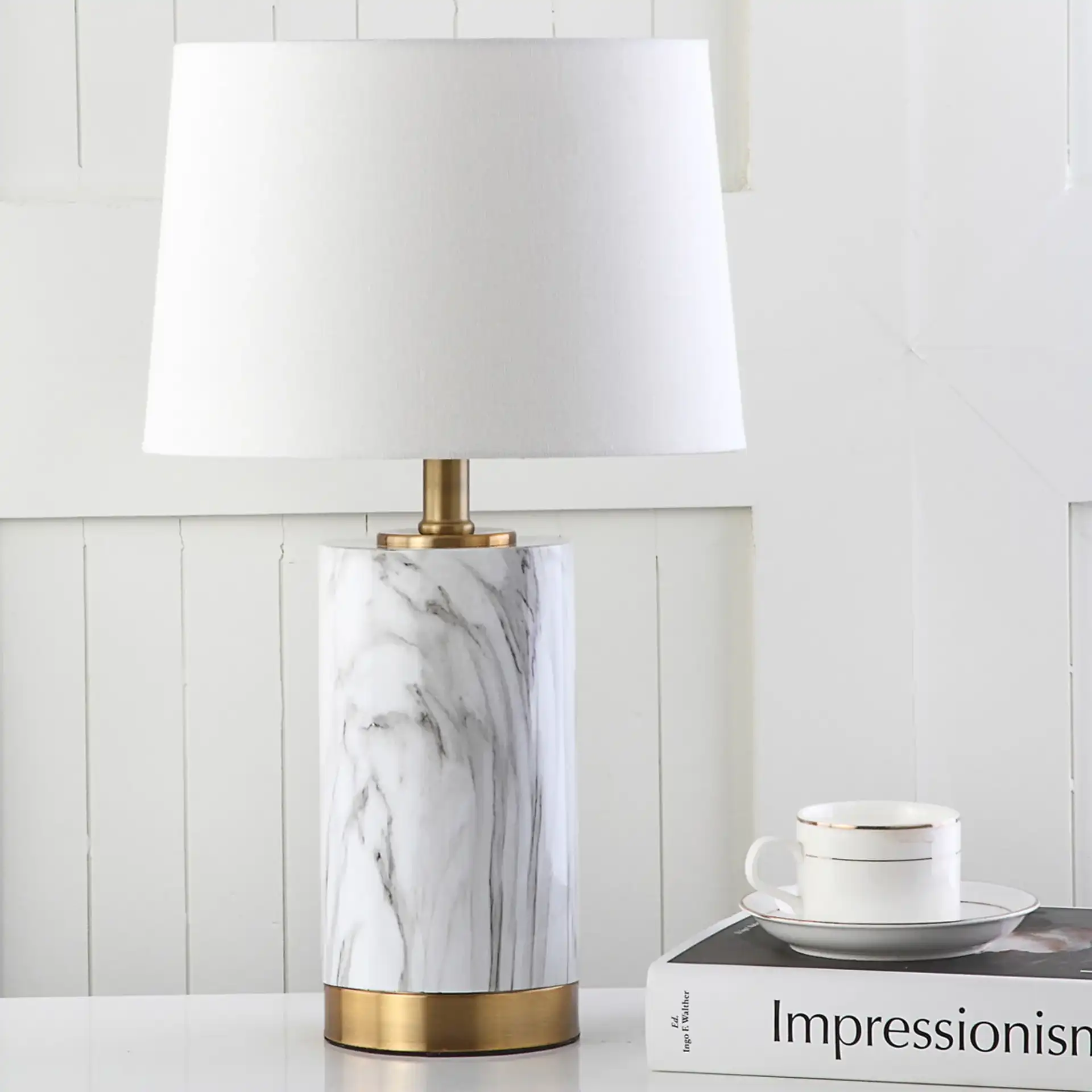 Winston Table Lamp in White Marble / Gold in a styled room