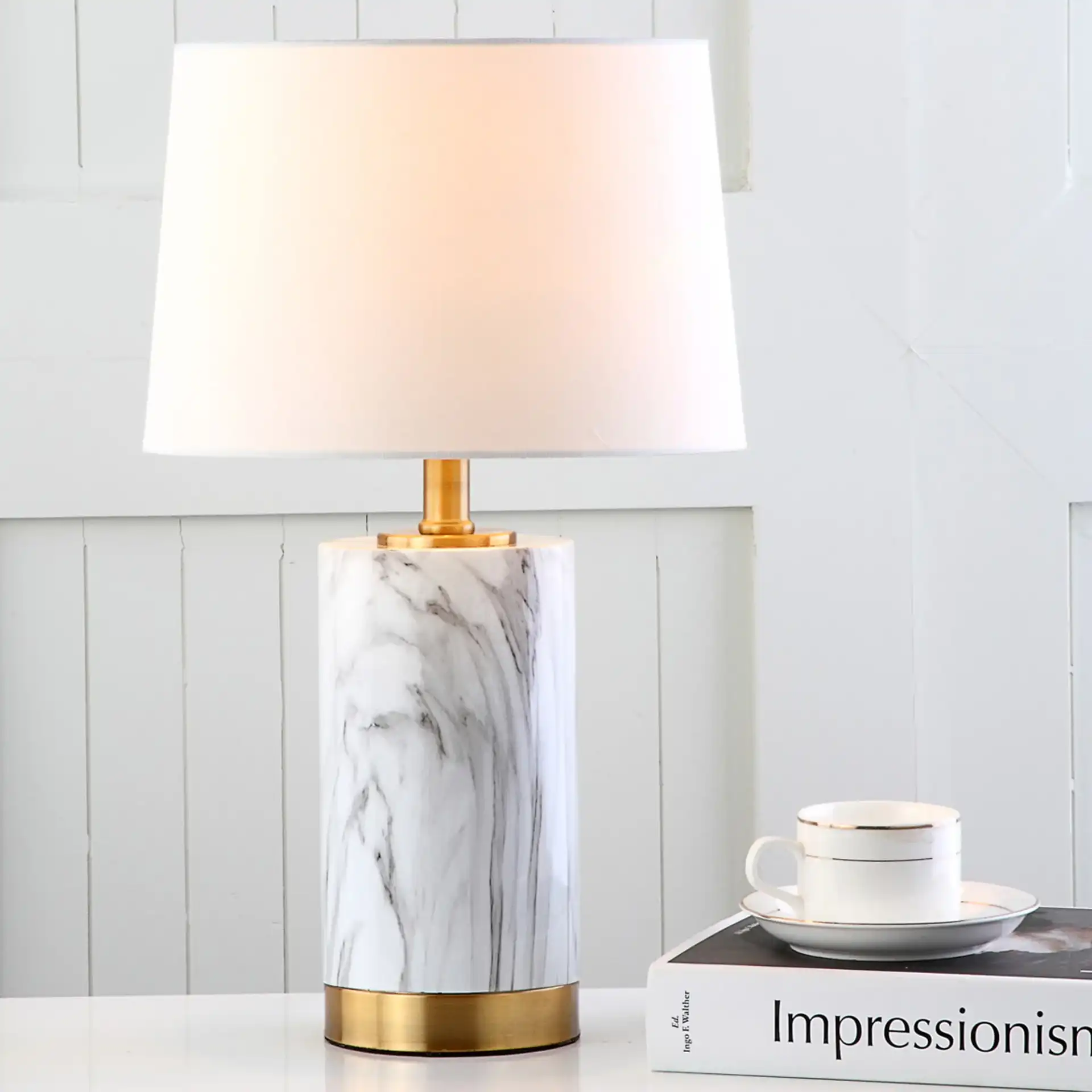 Winston Table Lamp in White Marble / Gold in a styled room