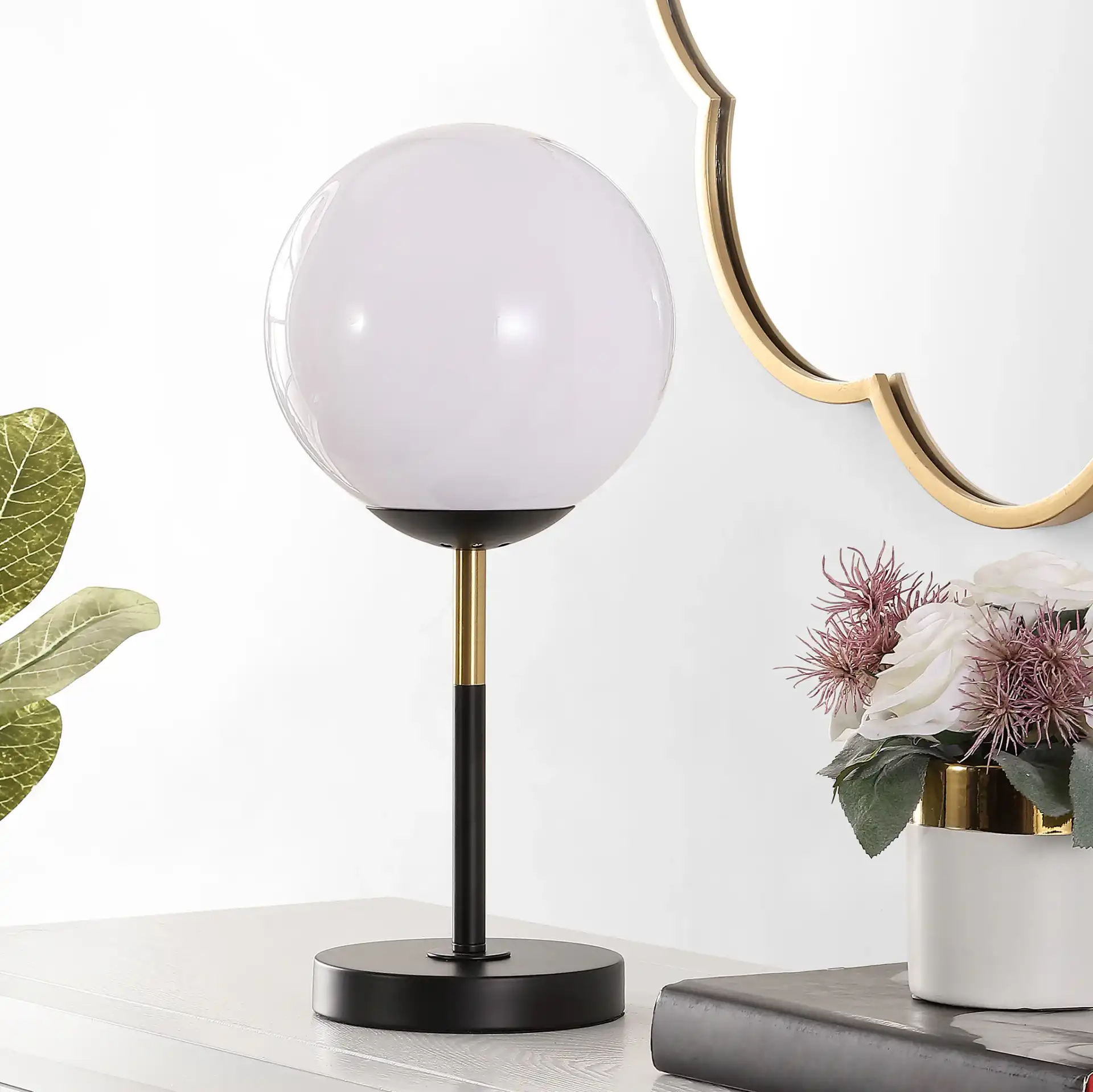Gemini Table Lamp in Black / Gold in a styled room