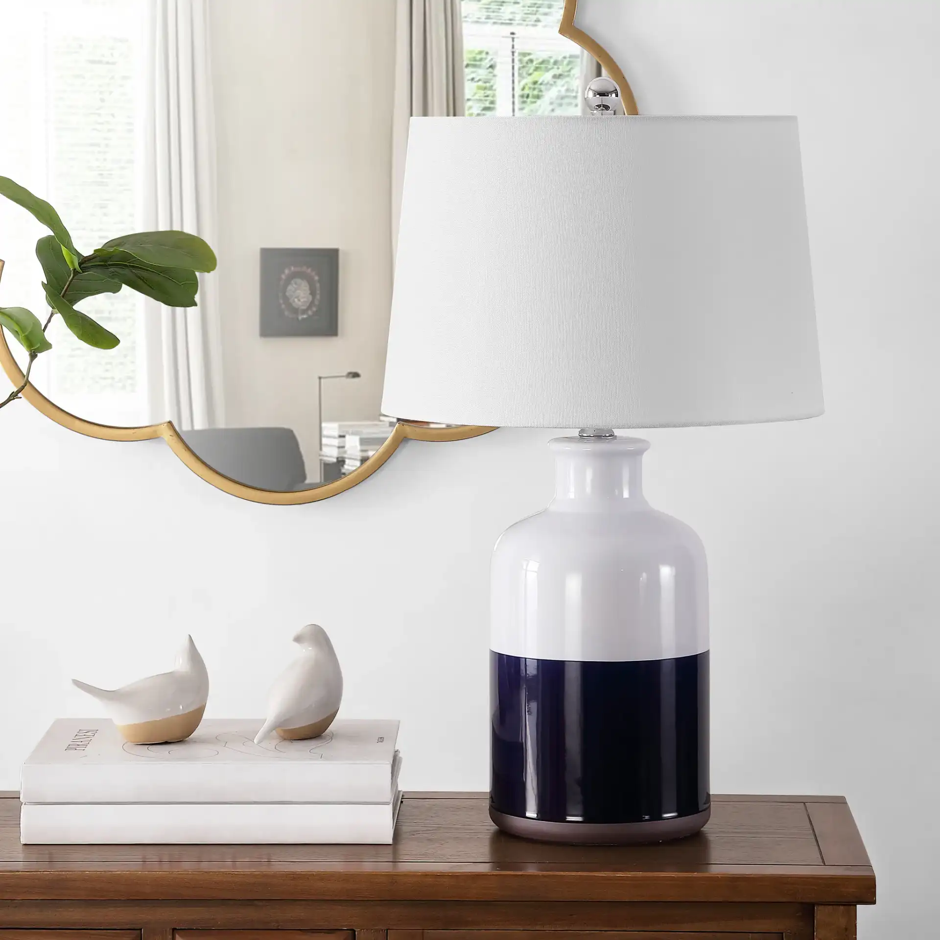 Dani Table Lamp in White / Navy Blue in a styled room