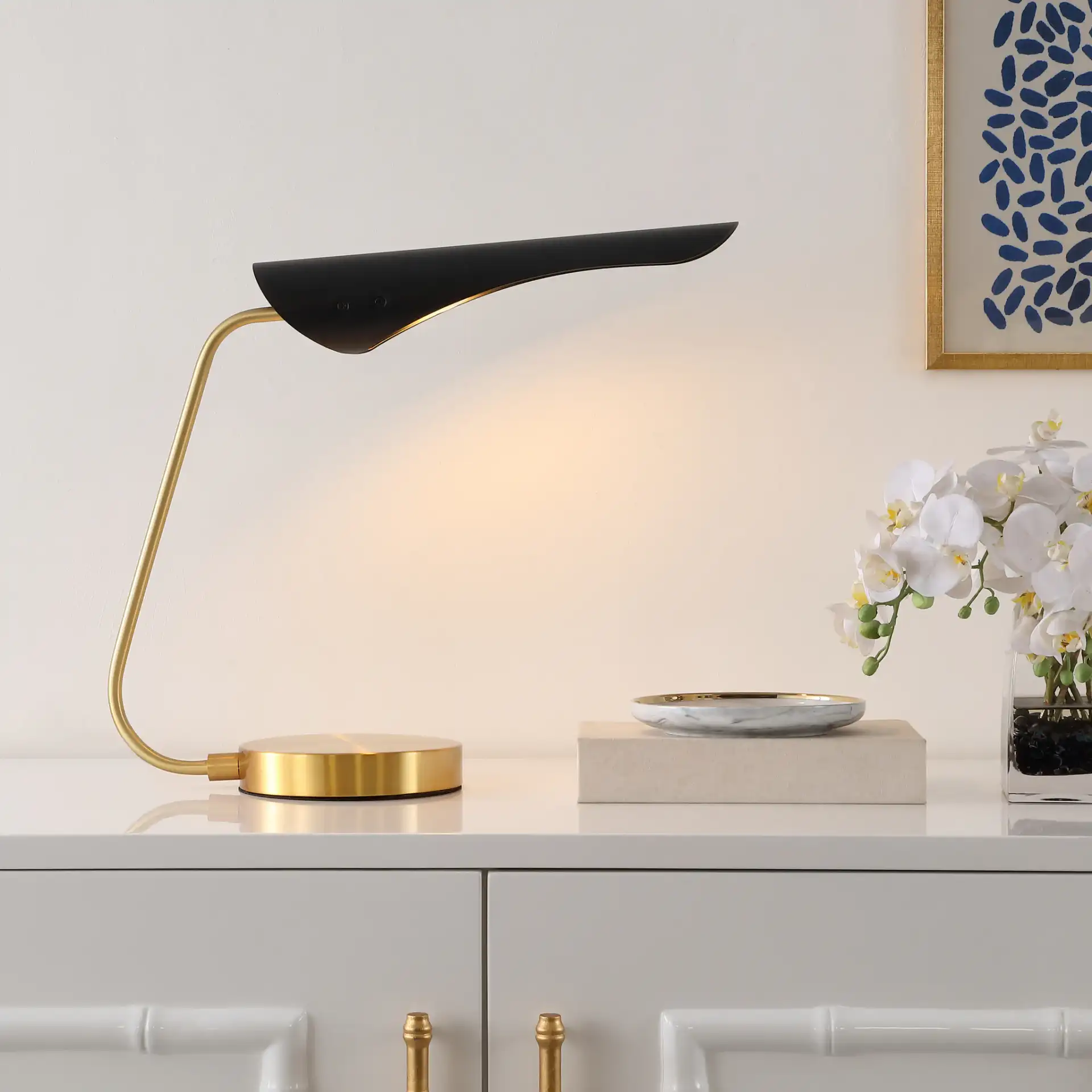 Fynn Table Lamp in Black / Brass in a styled room