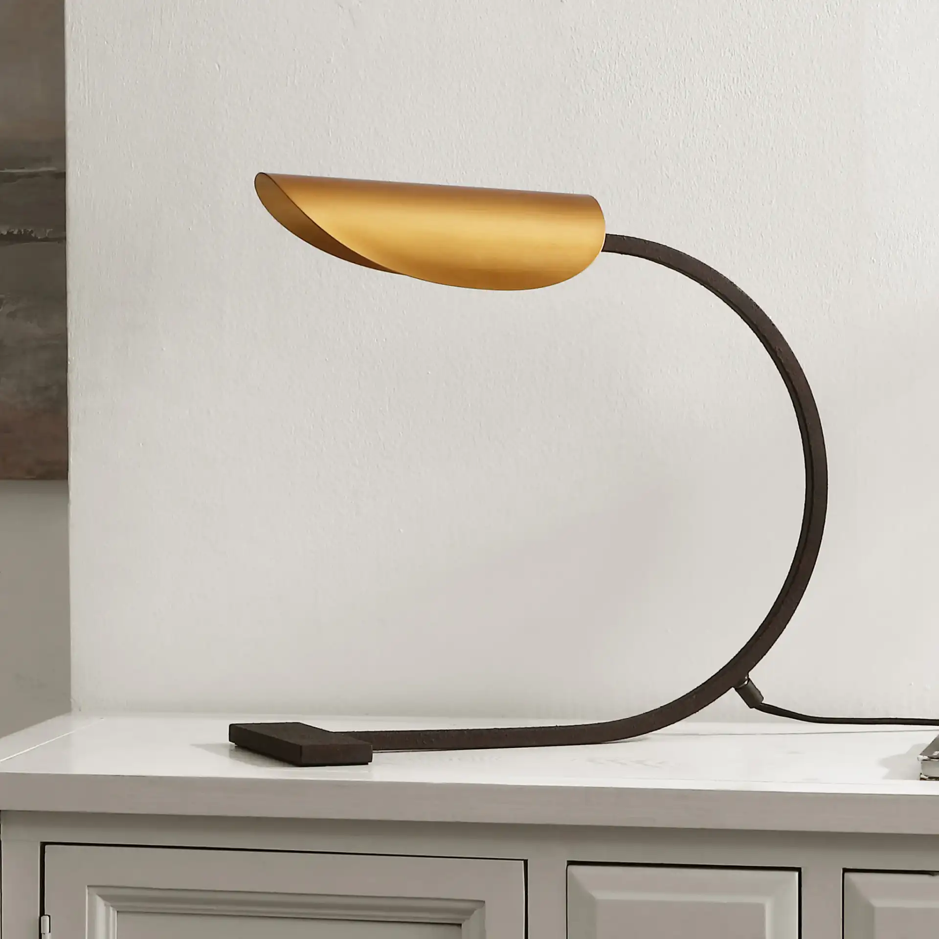 Mari Table Lamp in Antique Gold / Rust in a styled room