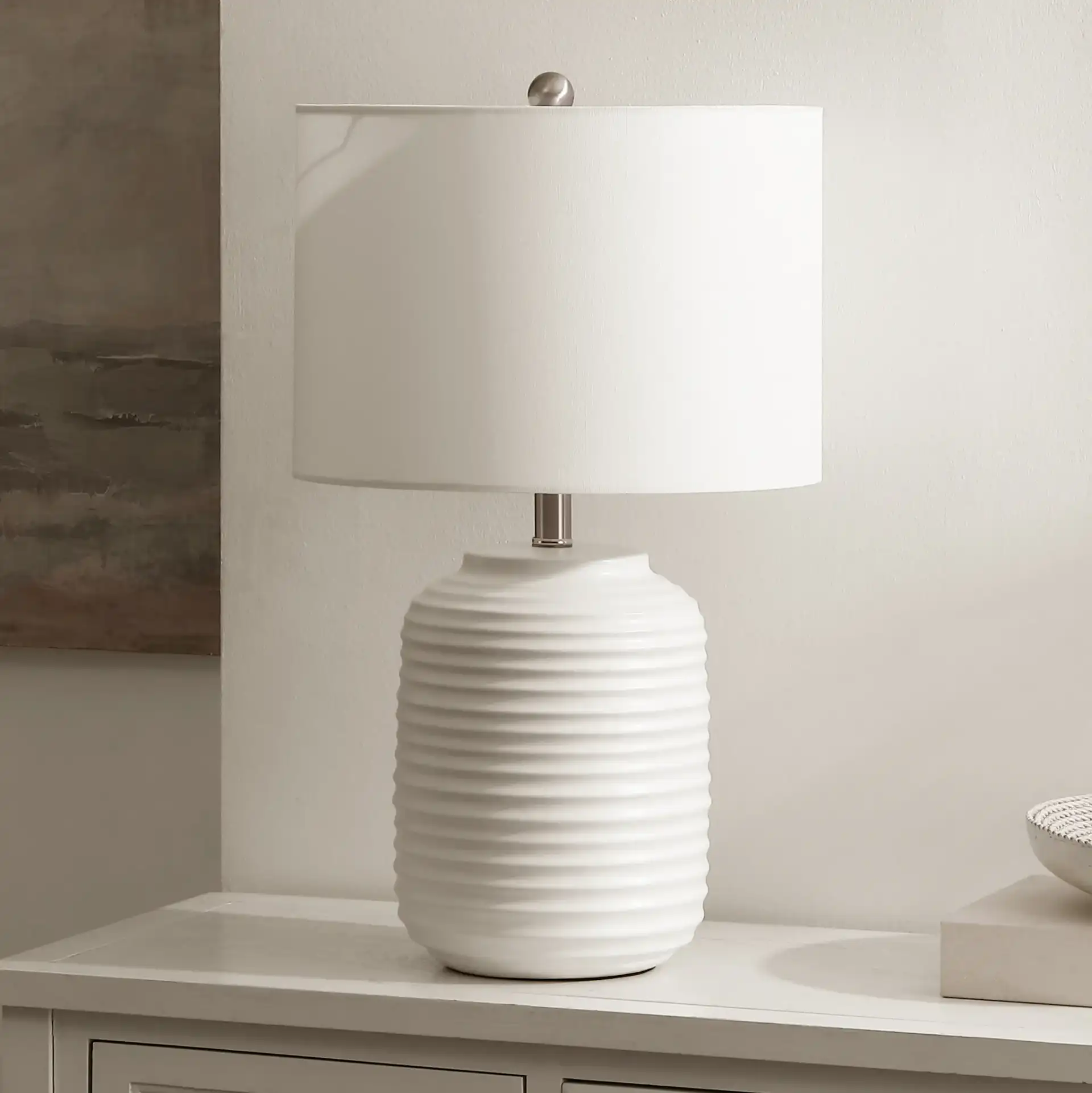 Elio Table Lamp in White in a styled room