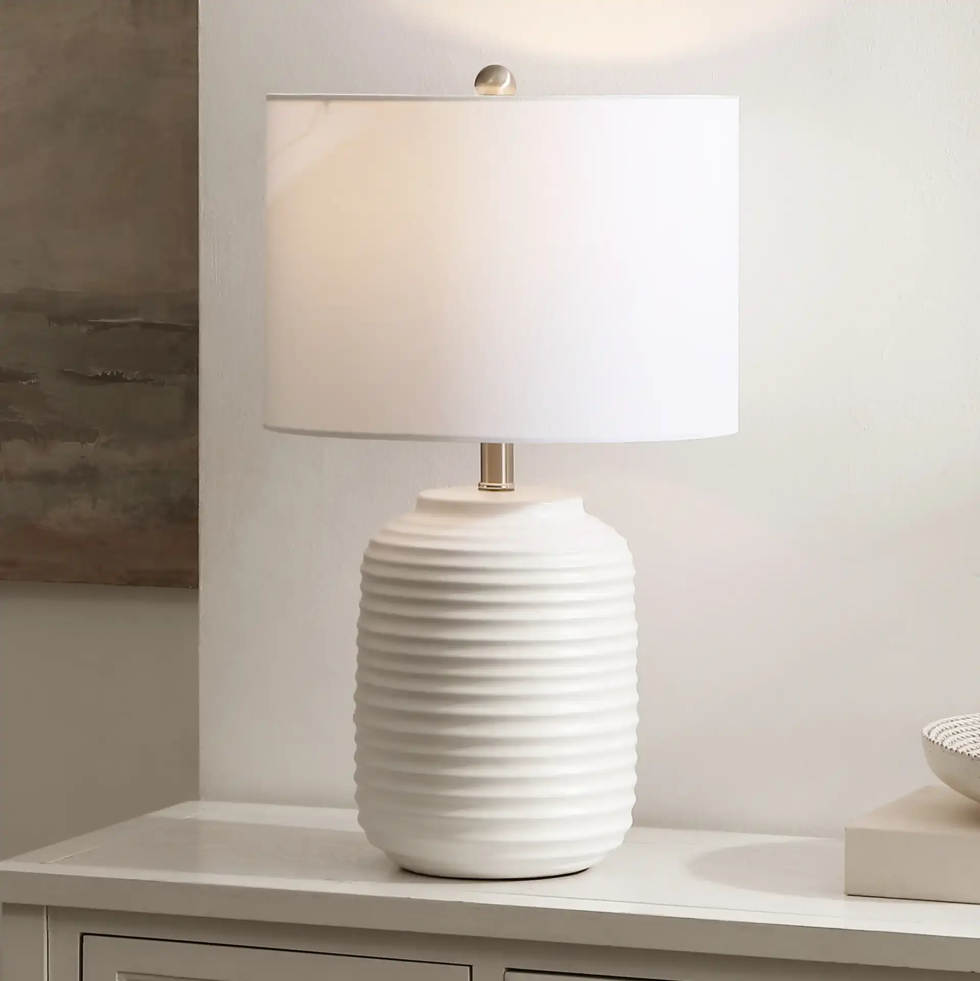 Elio Table Lamp in White in a styled room