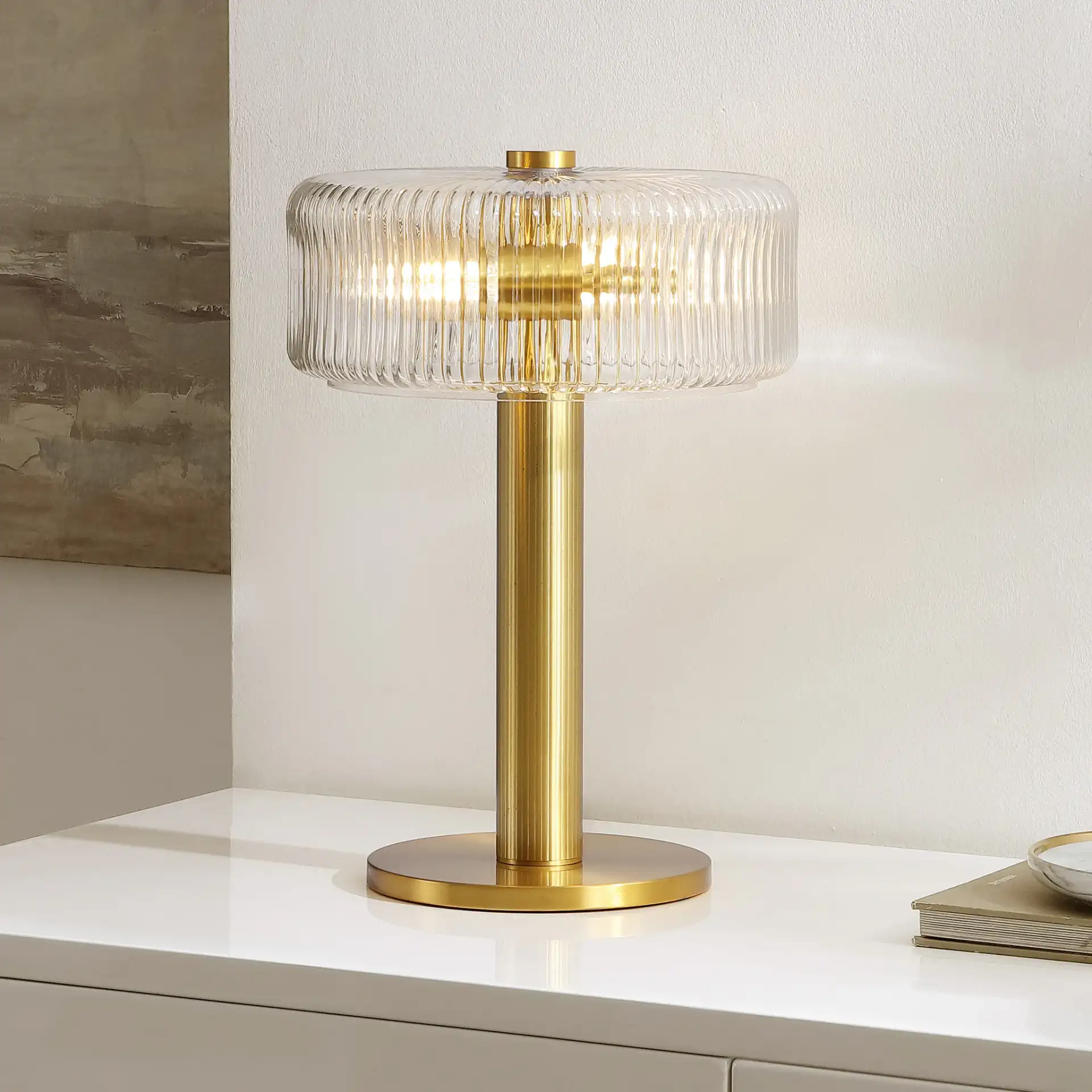 Dua Table Lamp in Clear / Brass in a styled room