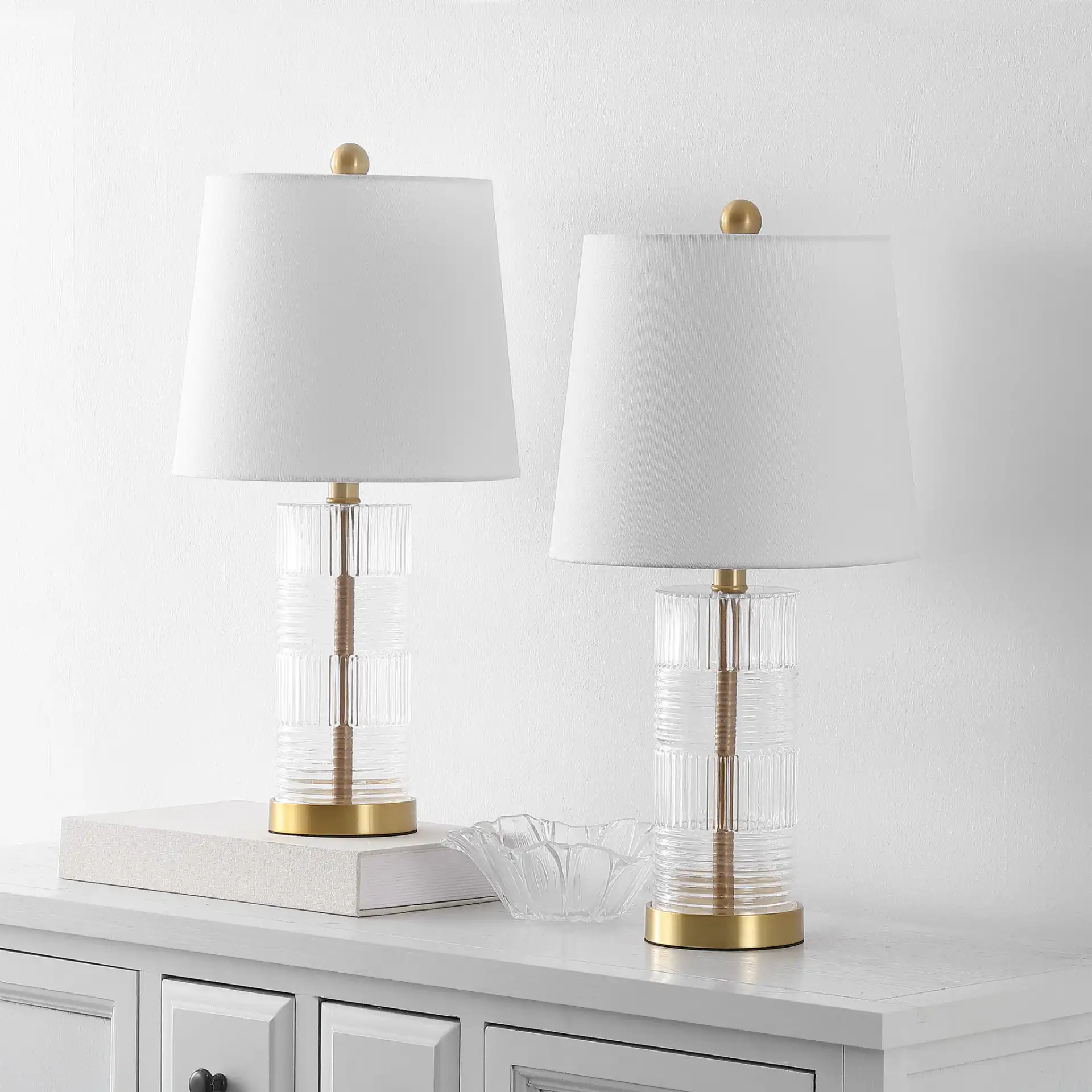Faille Table Lamp (Set Of 2) in Clear / Brass in a styled room