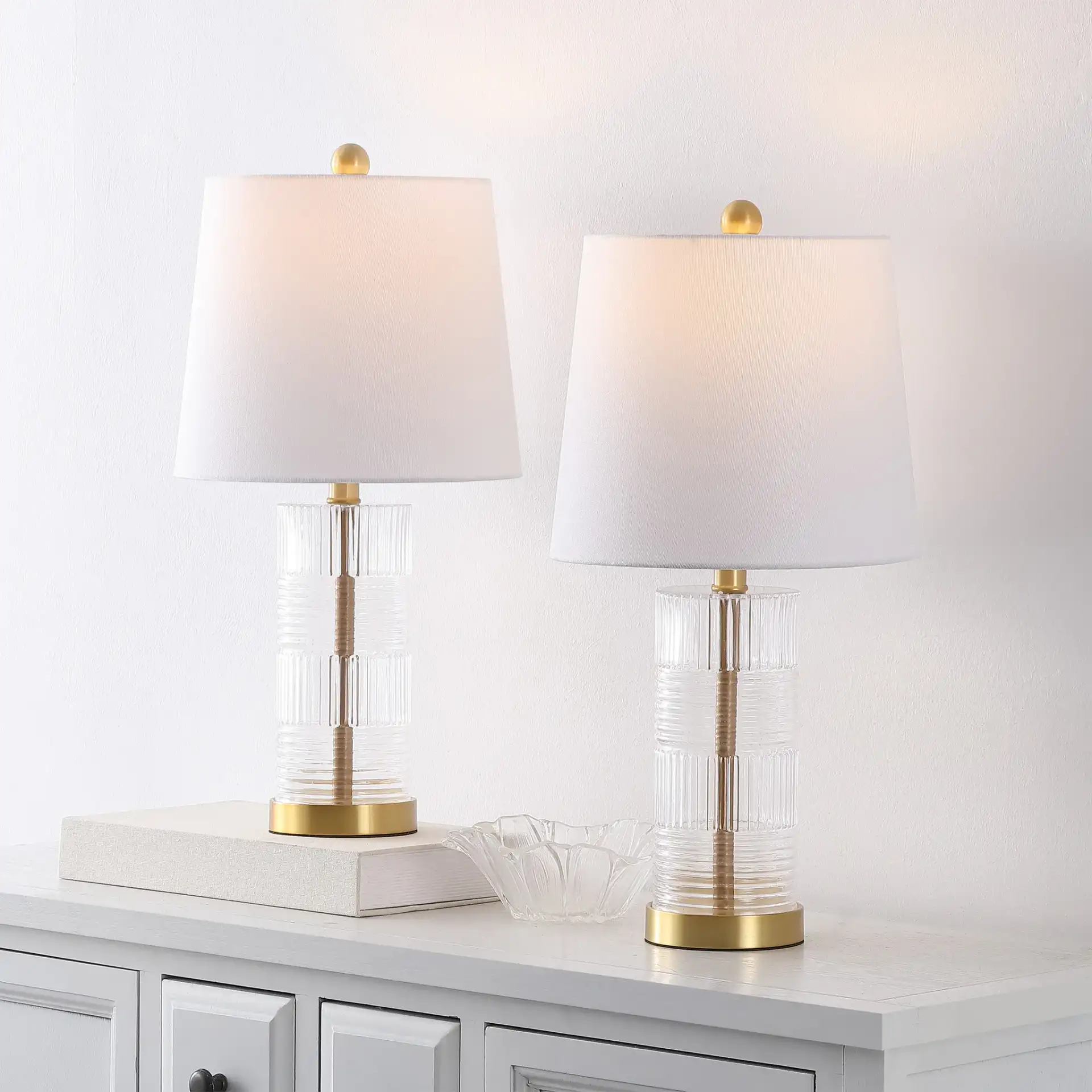 Faille Table Lamp (Set Of 2) in Clear / Brass in a styled room