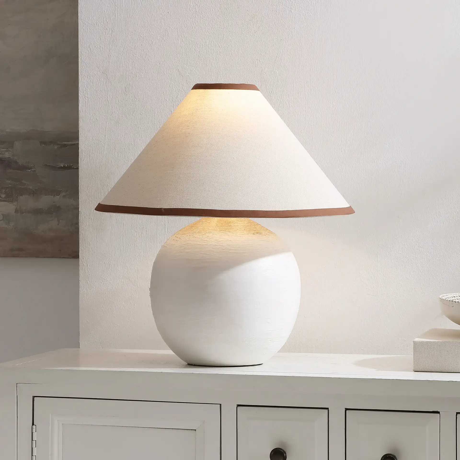 Daneela Table Lamp in White in a styled room