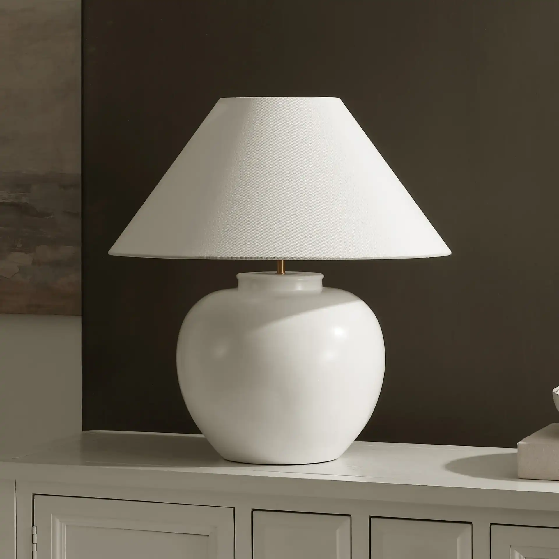 Korie Table Lamp in White in a styled room