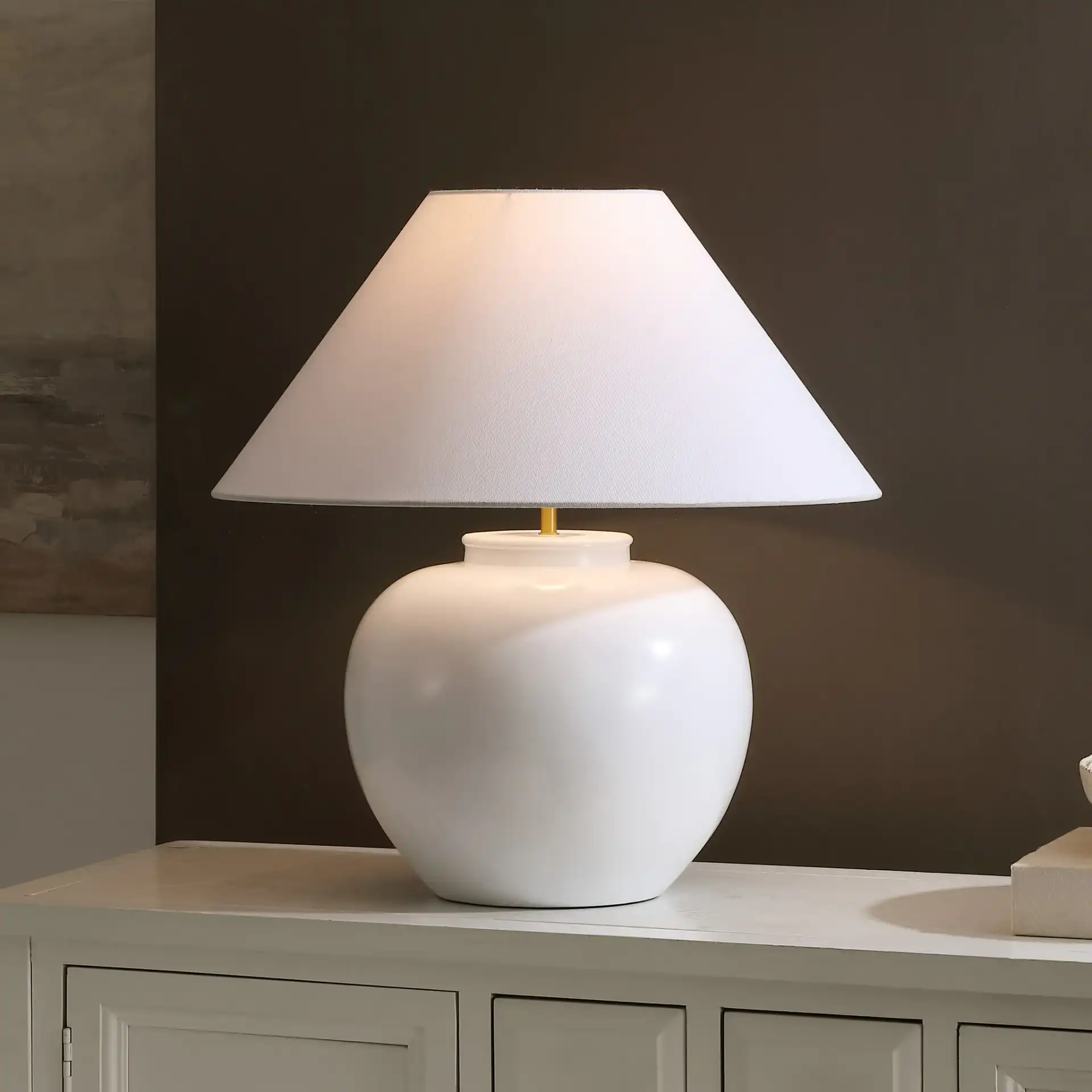 Korie Table Lamp in White in a styled room
