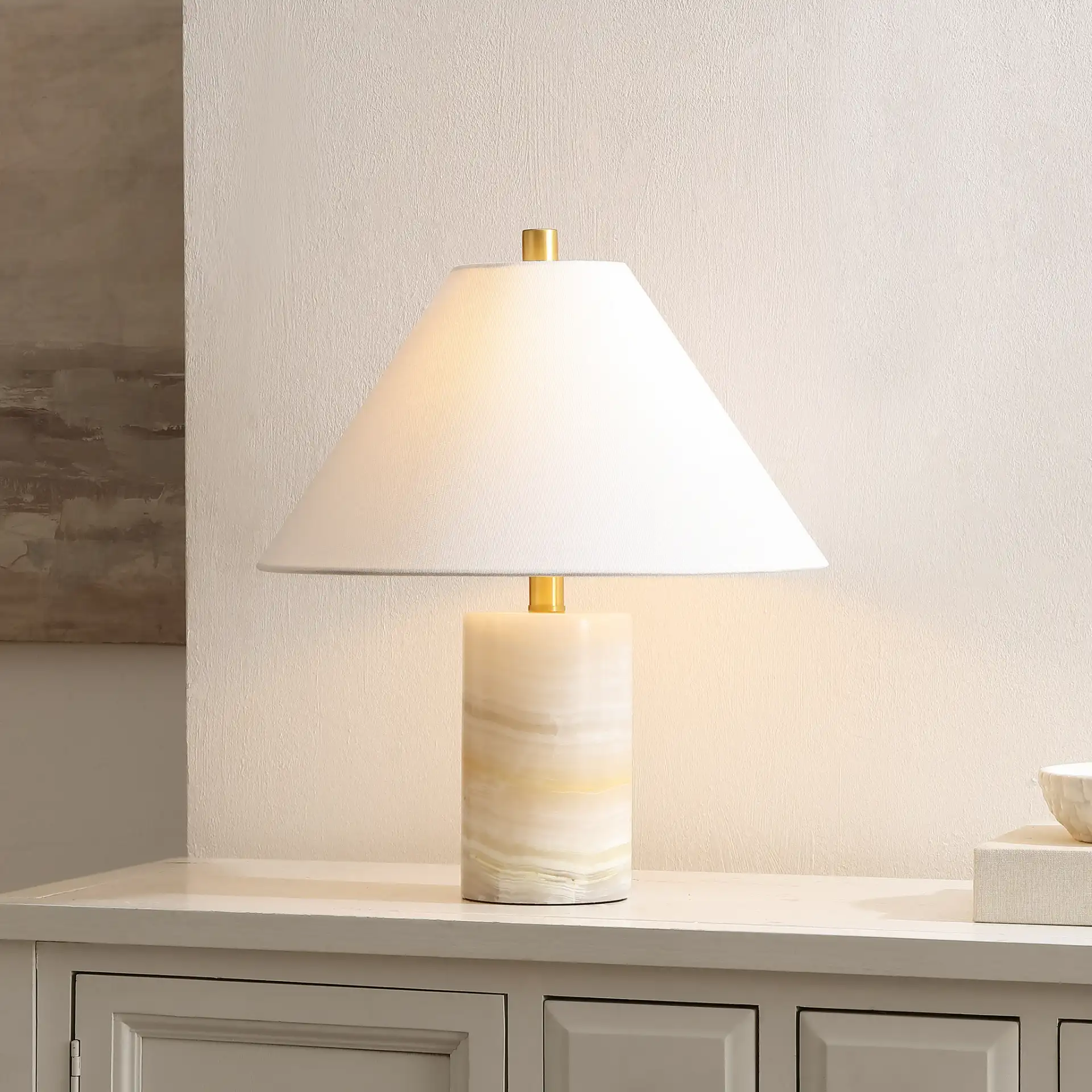 Naelle Table Lamp in White / Gold in a styled room