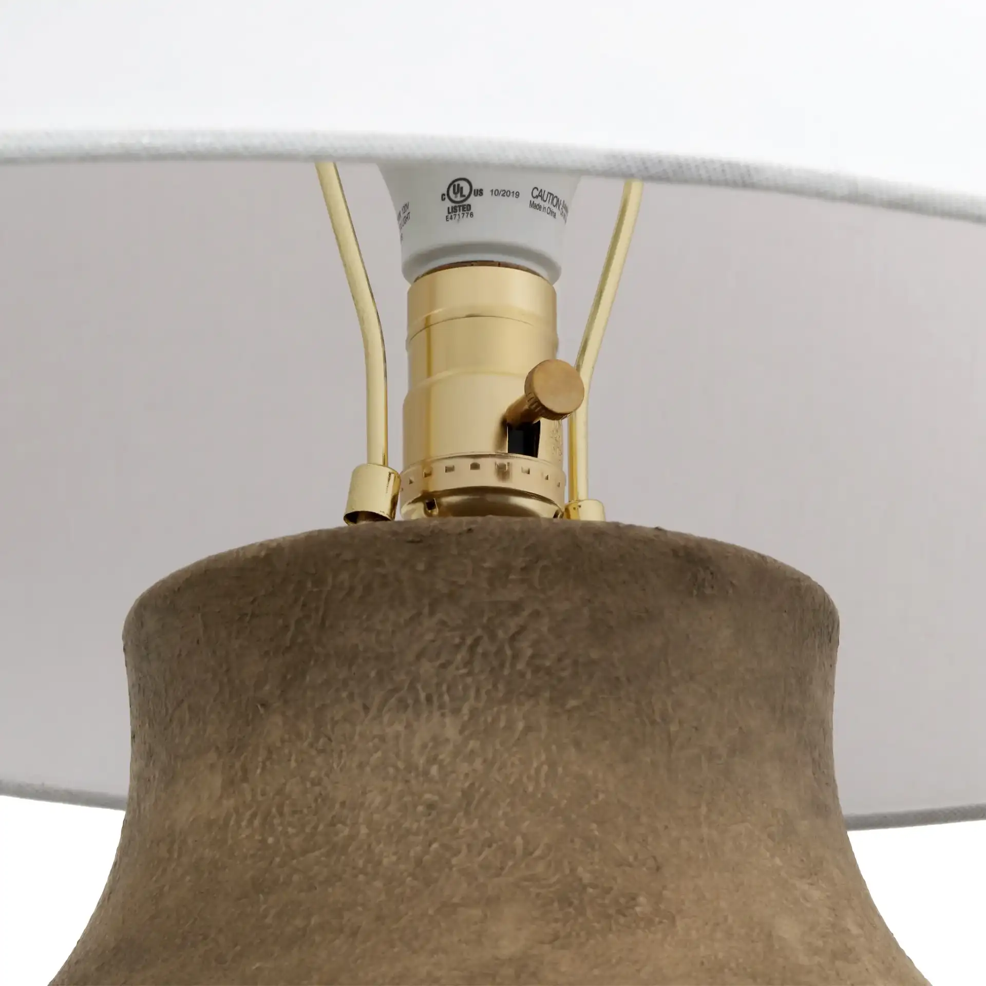 Wahkan Ceramic Table Lamp in Brown / White in a styled room