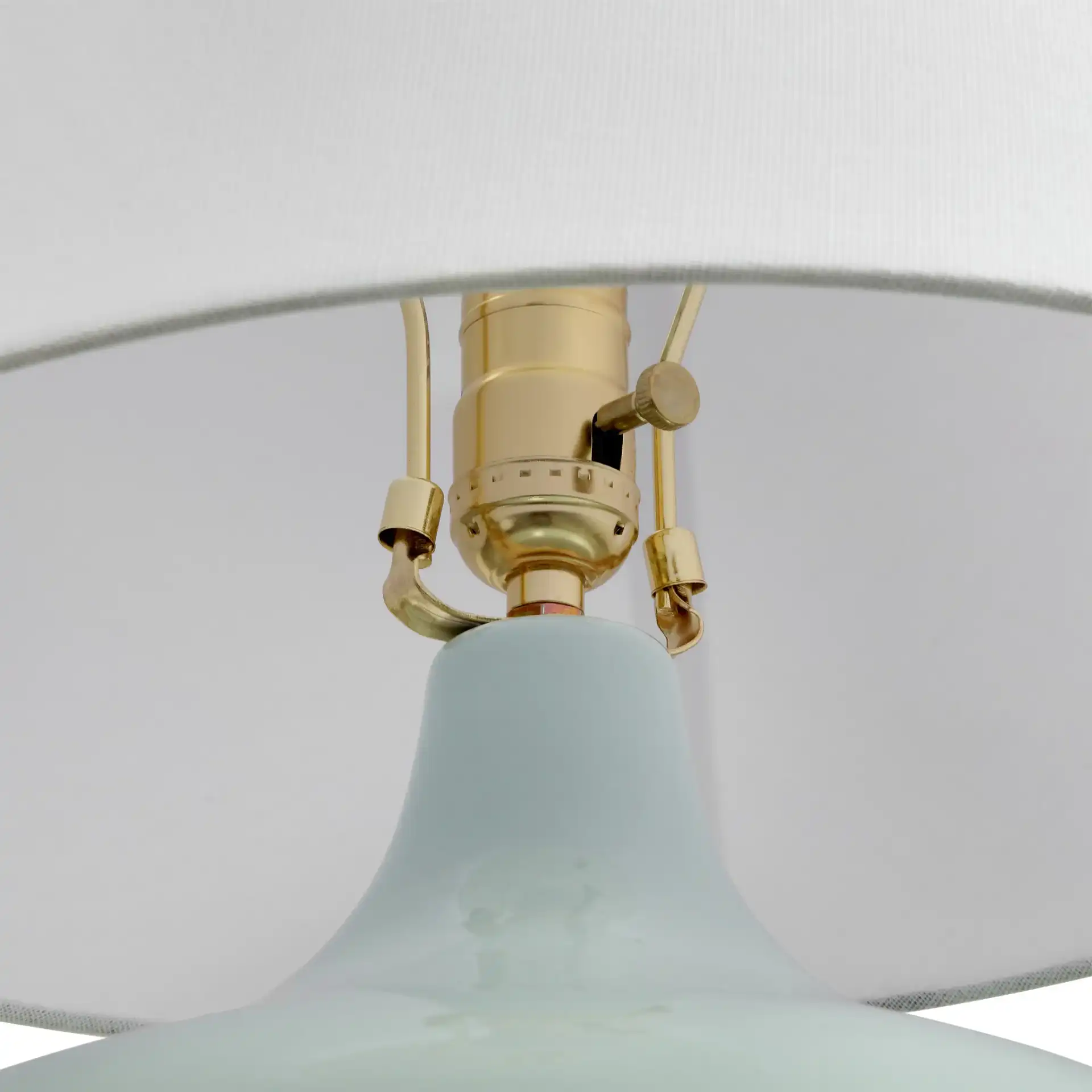 Waneta Ceramic Table Lamp in Light Blue / White in a styled room