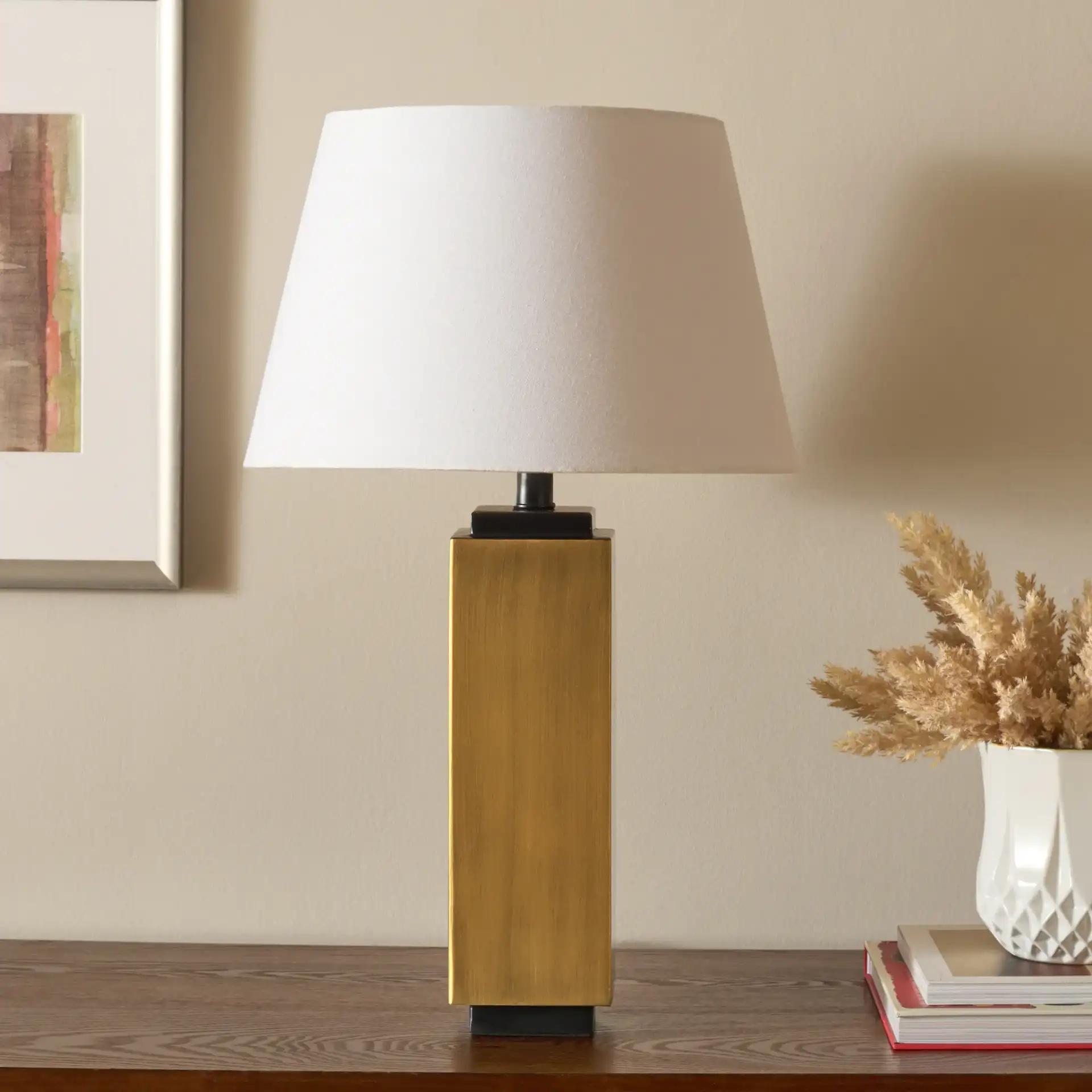 Balena Table Lamp in Antique Brass in a styled room