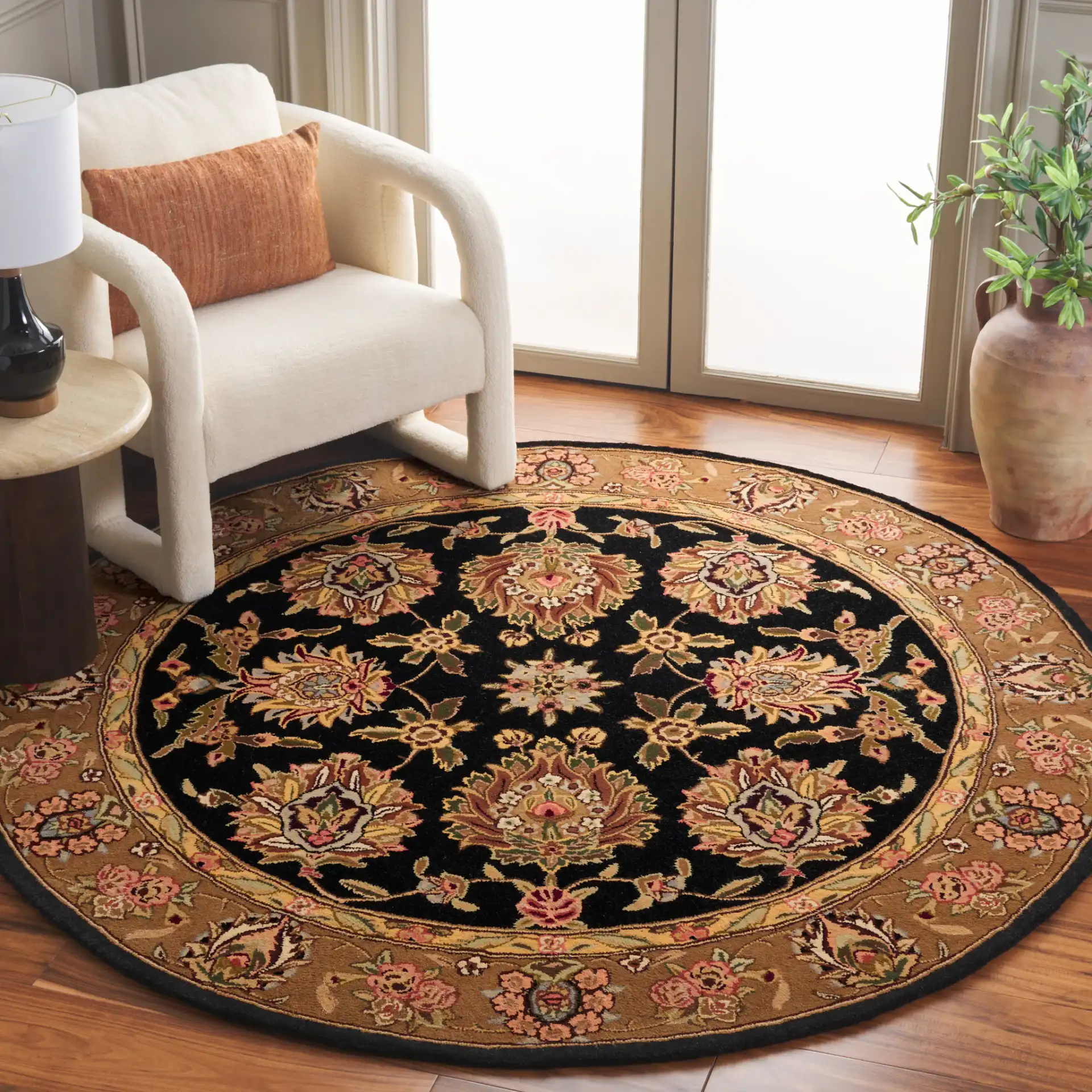 Traditions Floral Medallion Wool Rug in Black / Gold in a styled room