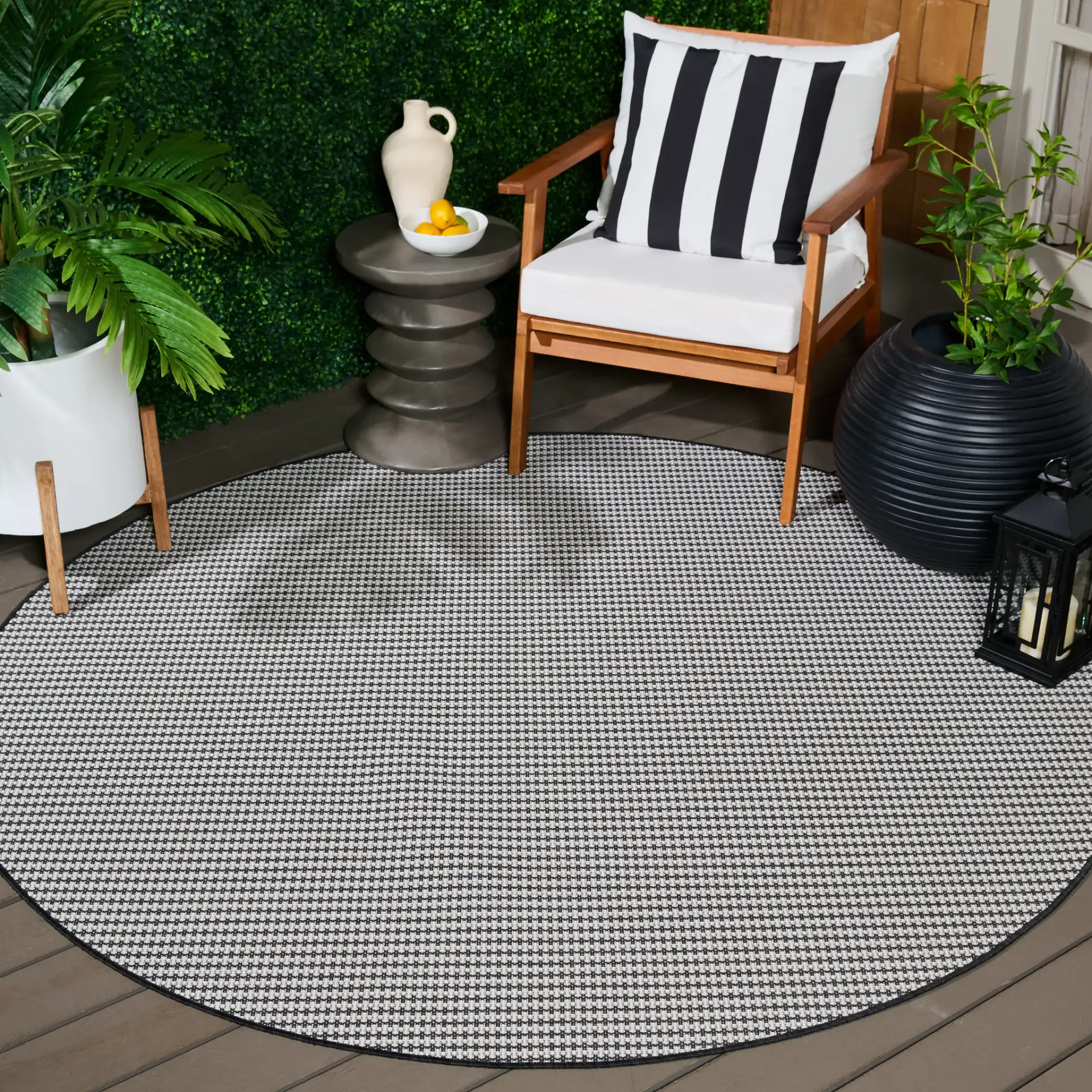 Terrace Basketweave Outdoor Rug in Black / White in a styled room