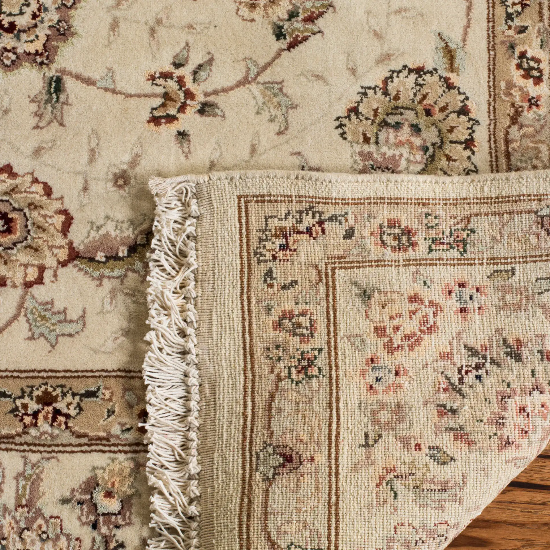 Tabriz Floral Arabesque Bordered Rug in Ivory in a styled room