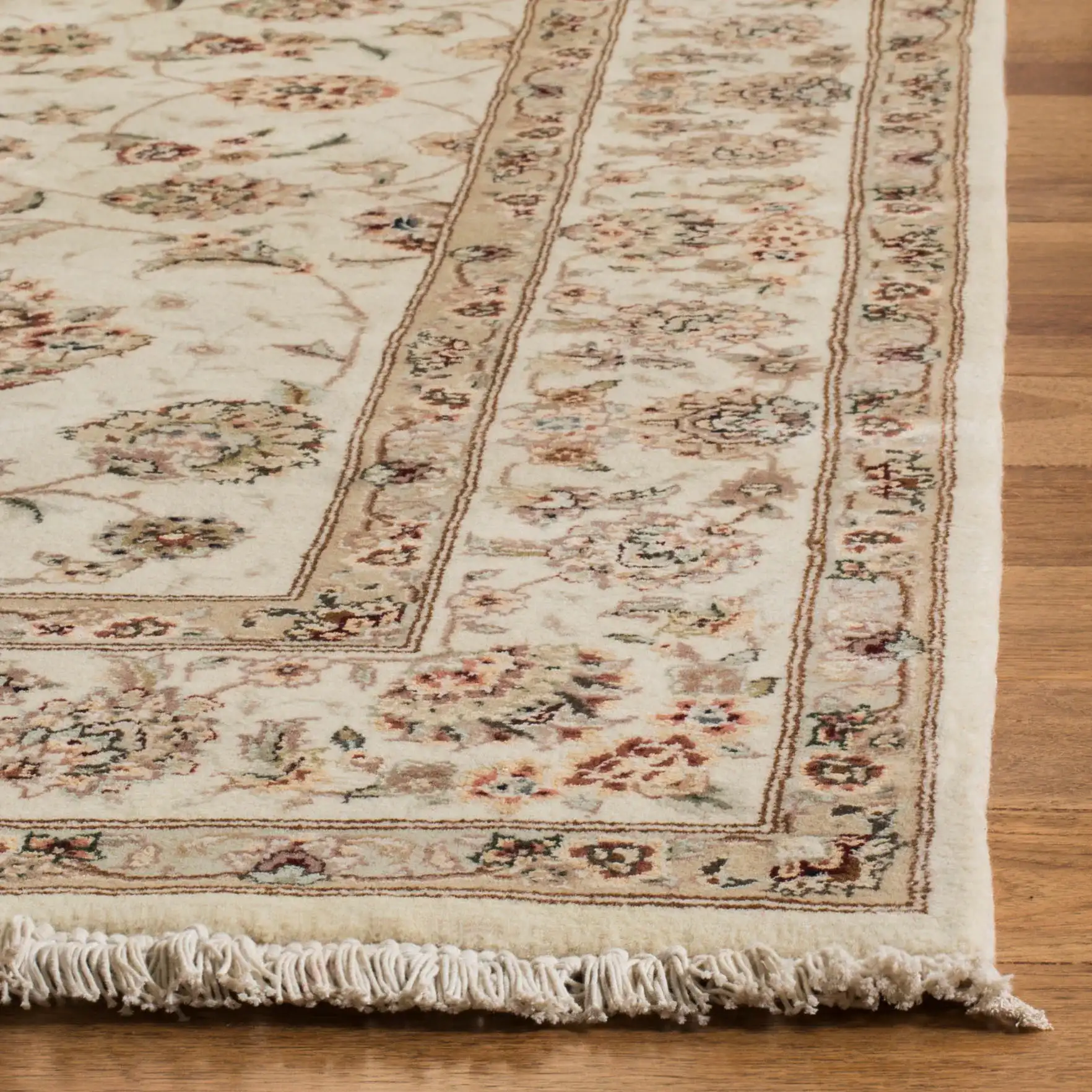 Tabriz Floral Arabesque Bordered Rug in Ivory in a styled room