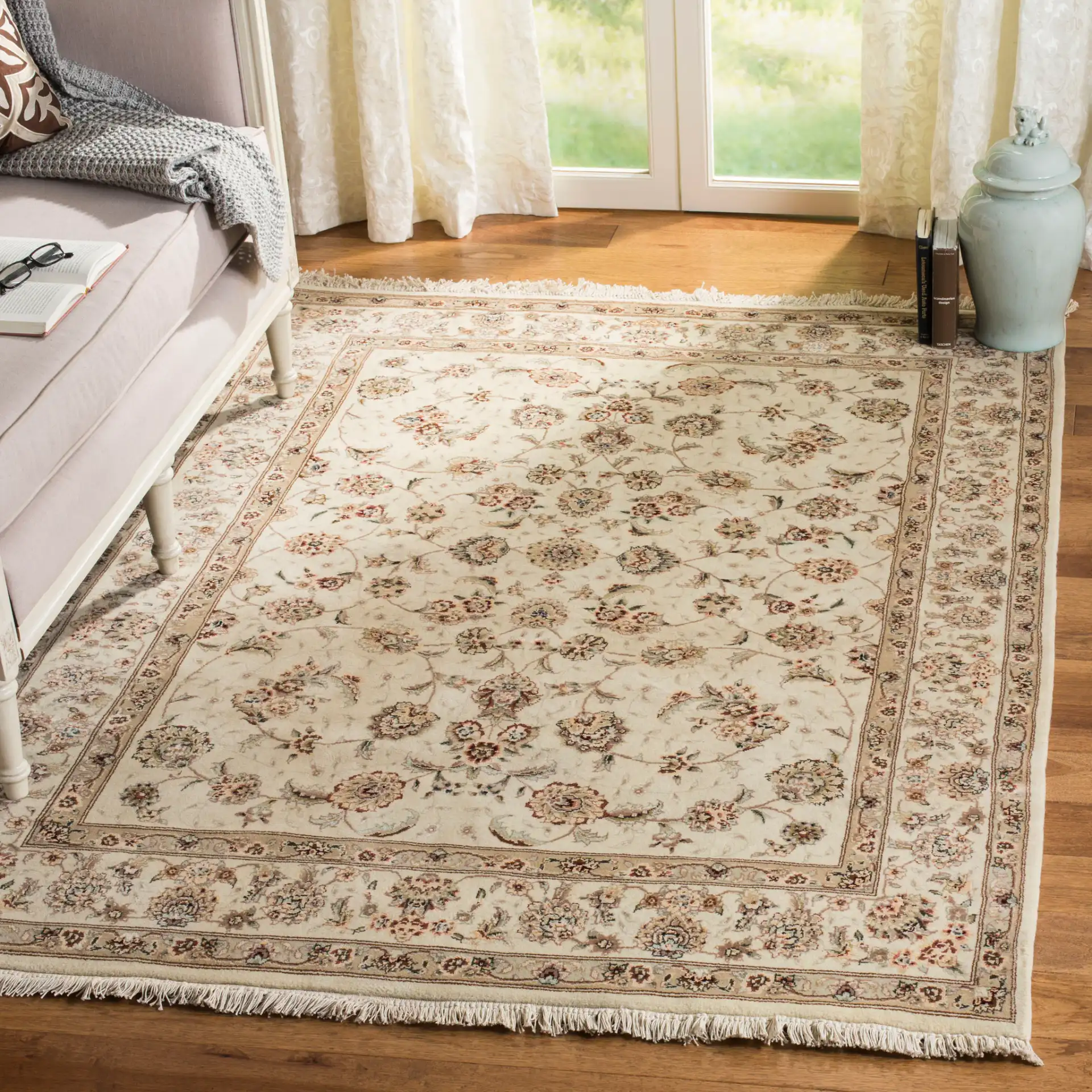 Tabriz Floral Arabesque Bordered Rug in Ivory in a styled room