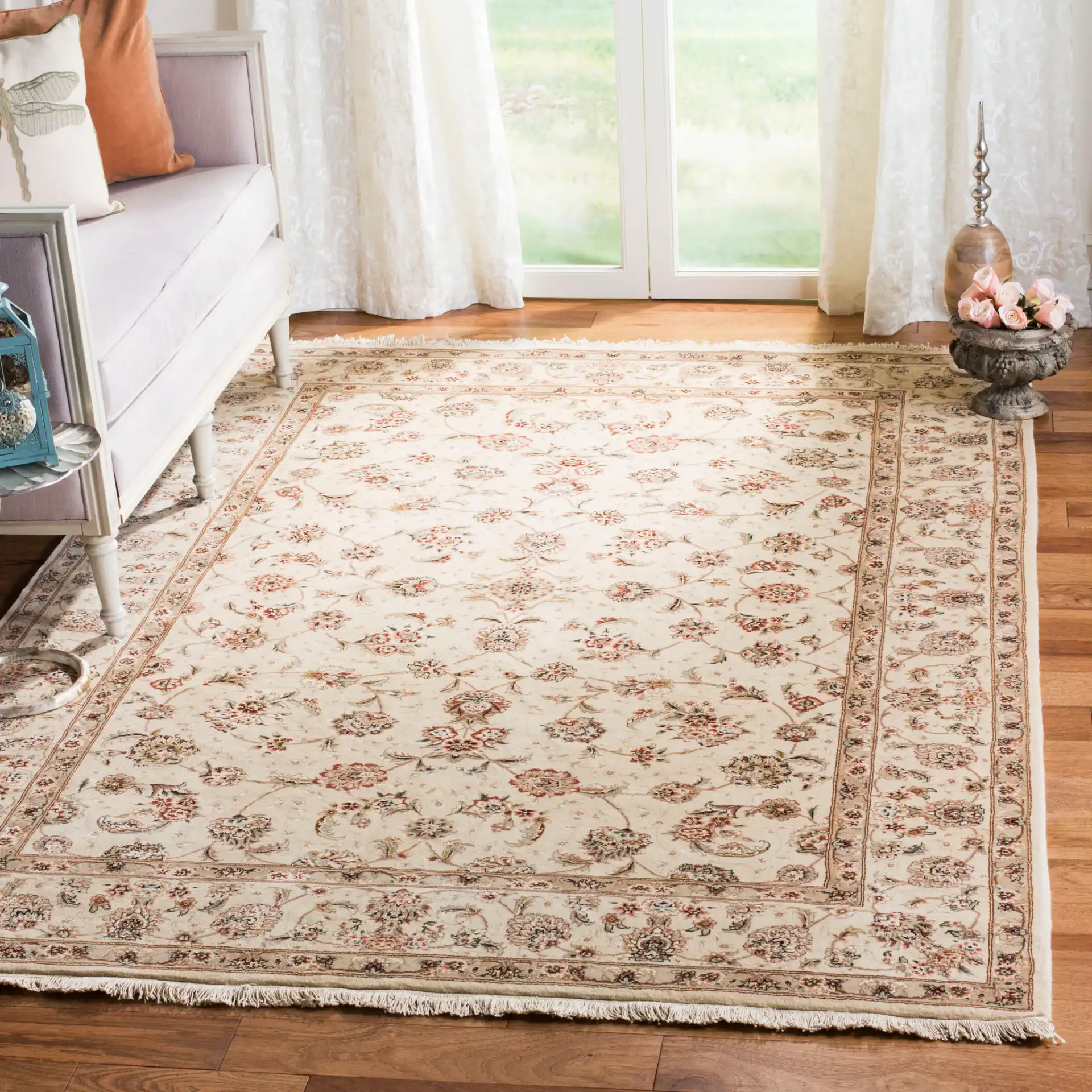 Tabriz Floral Arabesque Bordered Rug in Ivory in a styled room