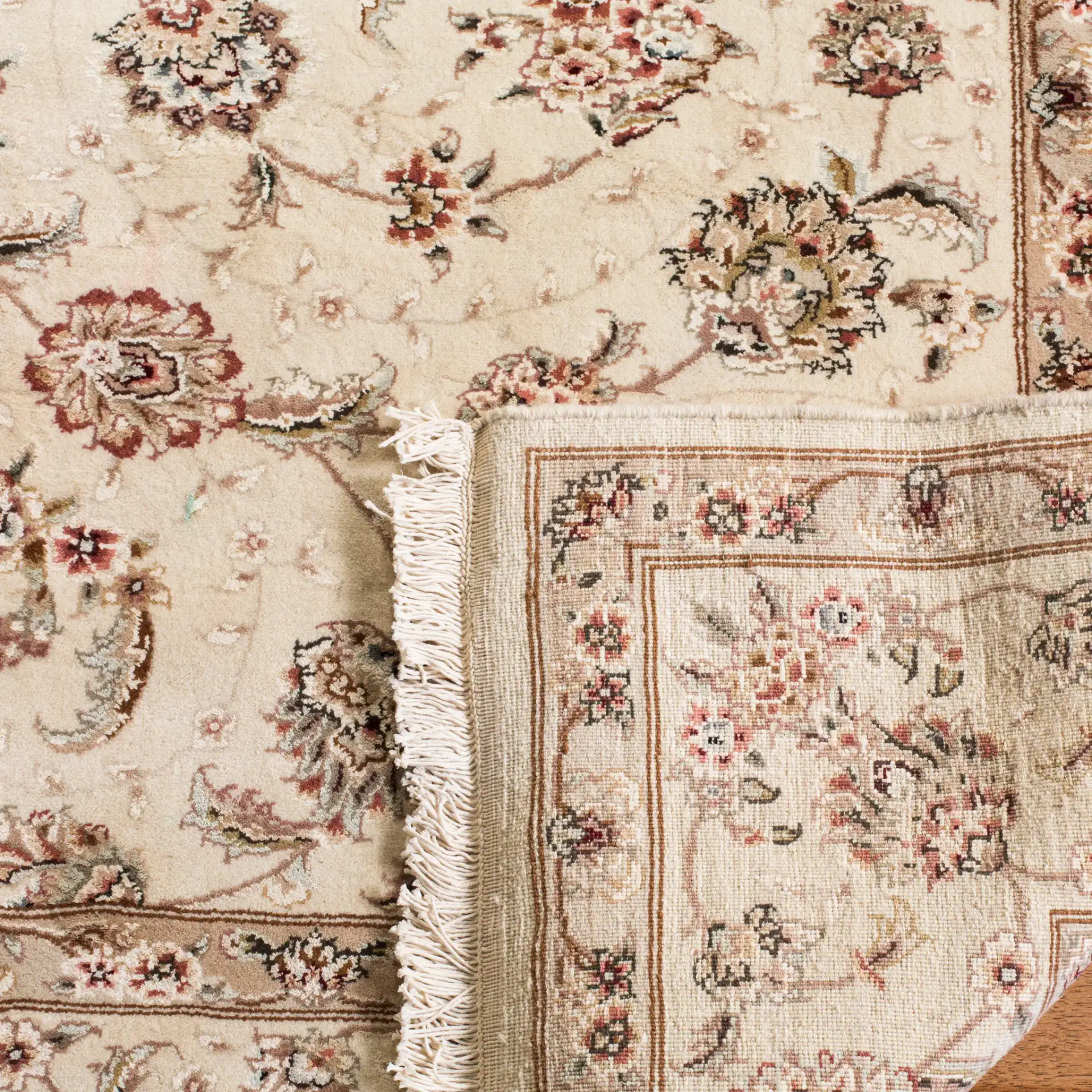 Tabriz Floral Arabesque Bordered Rug in Ivory in a styled room