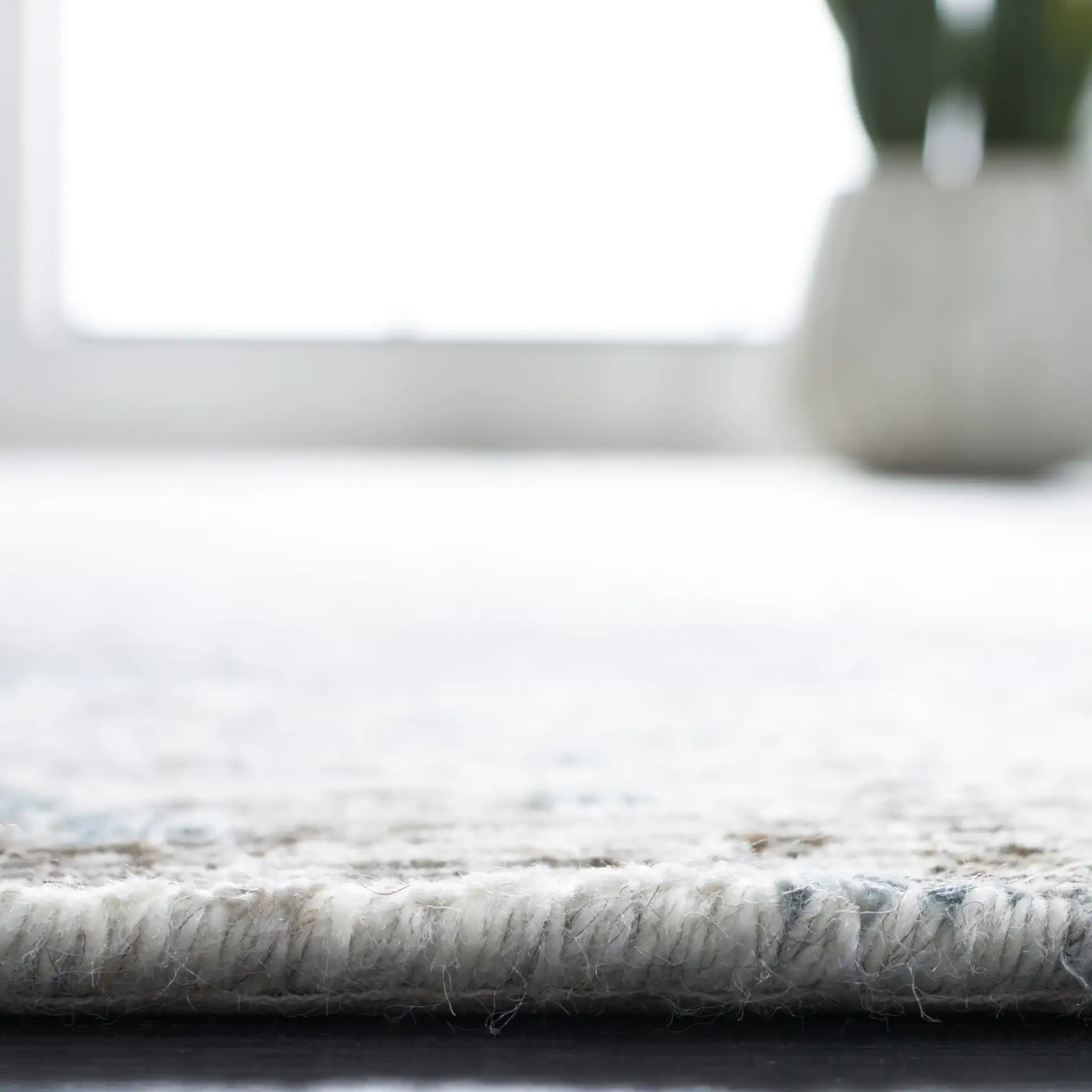 Tiffany Striated Abstract Hand-Knotted Rug in Silver / Blue in a styled room