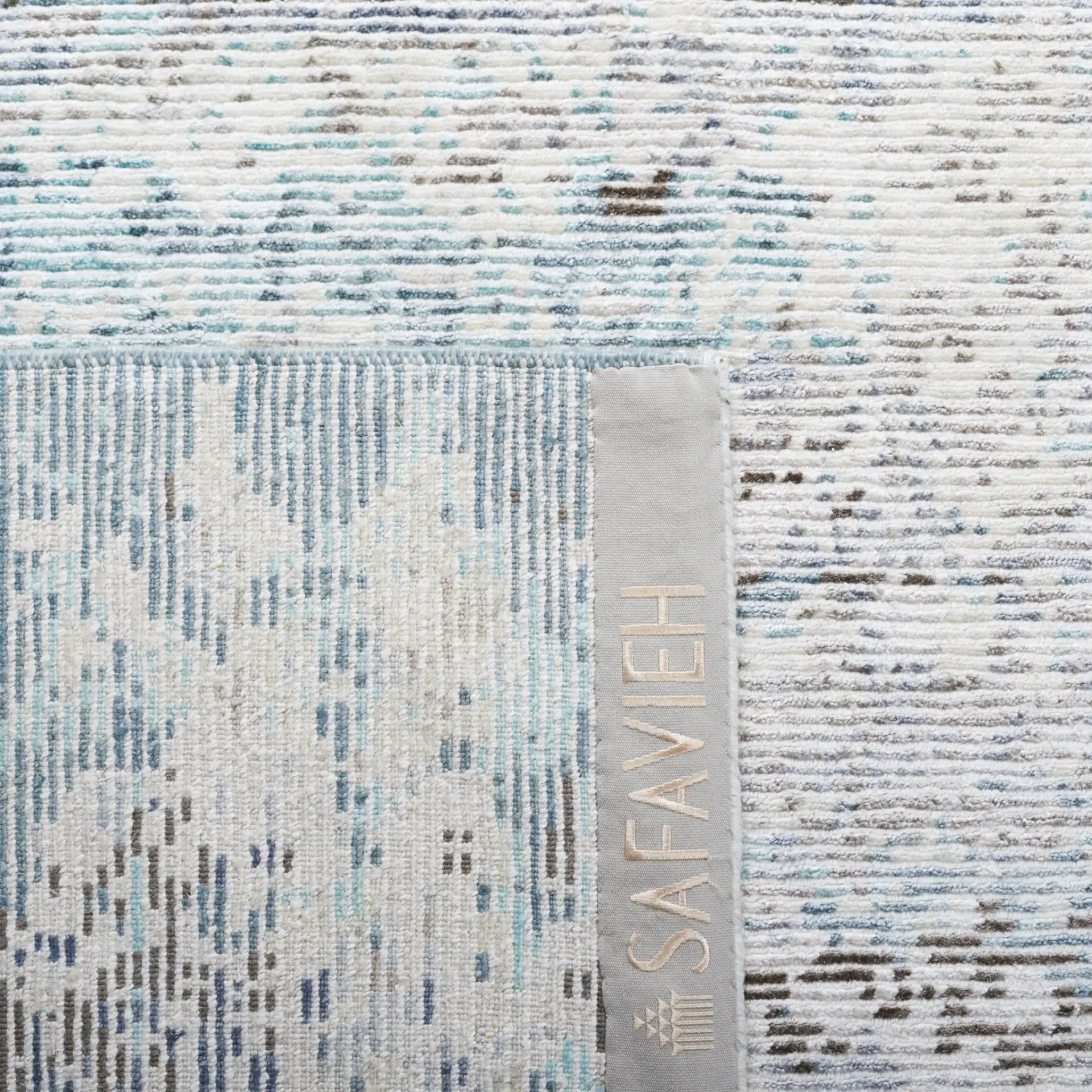Tiffany Striated Abstract Hand-Knotted Rug in Silver / Blue in a styled room