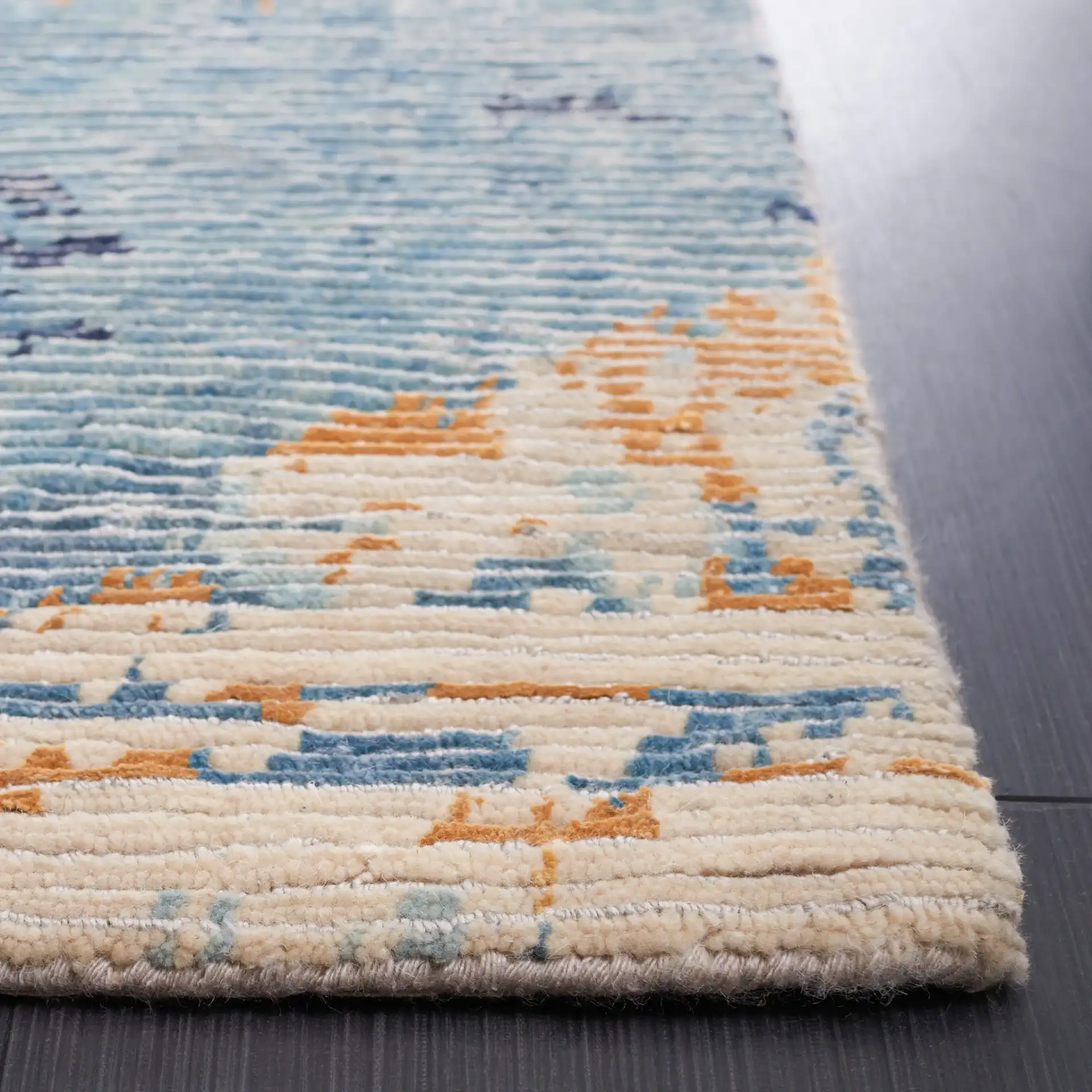 Tiffany Painterly Abstract Hand-Knotted Rug in Navy / Gold in a styled room