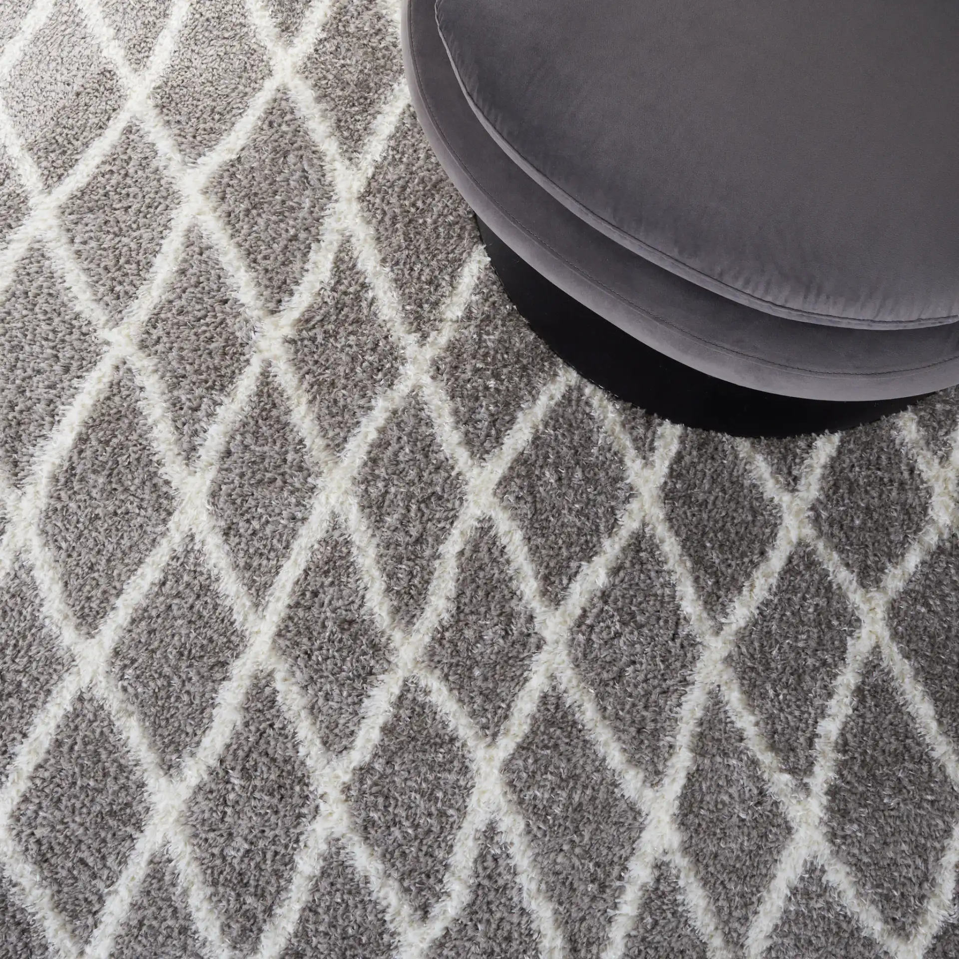 Tahoe Elongated Diamond Shag Rug in Gray / White in a styled room