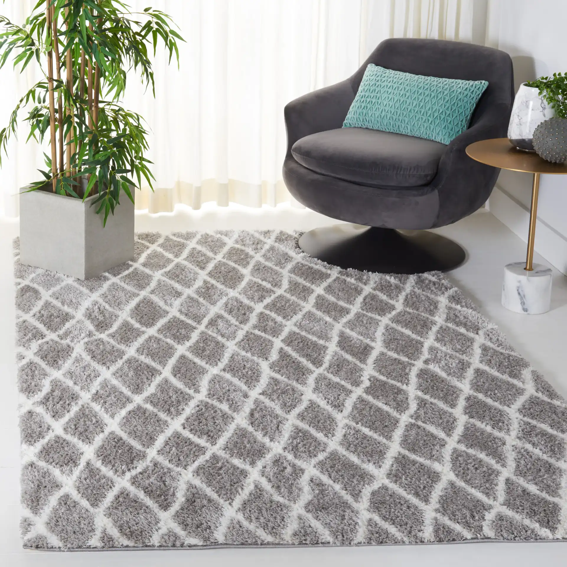 Tahoe Elongated Diamond Shag Rug in Gray / White in a styled room