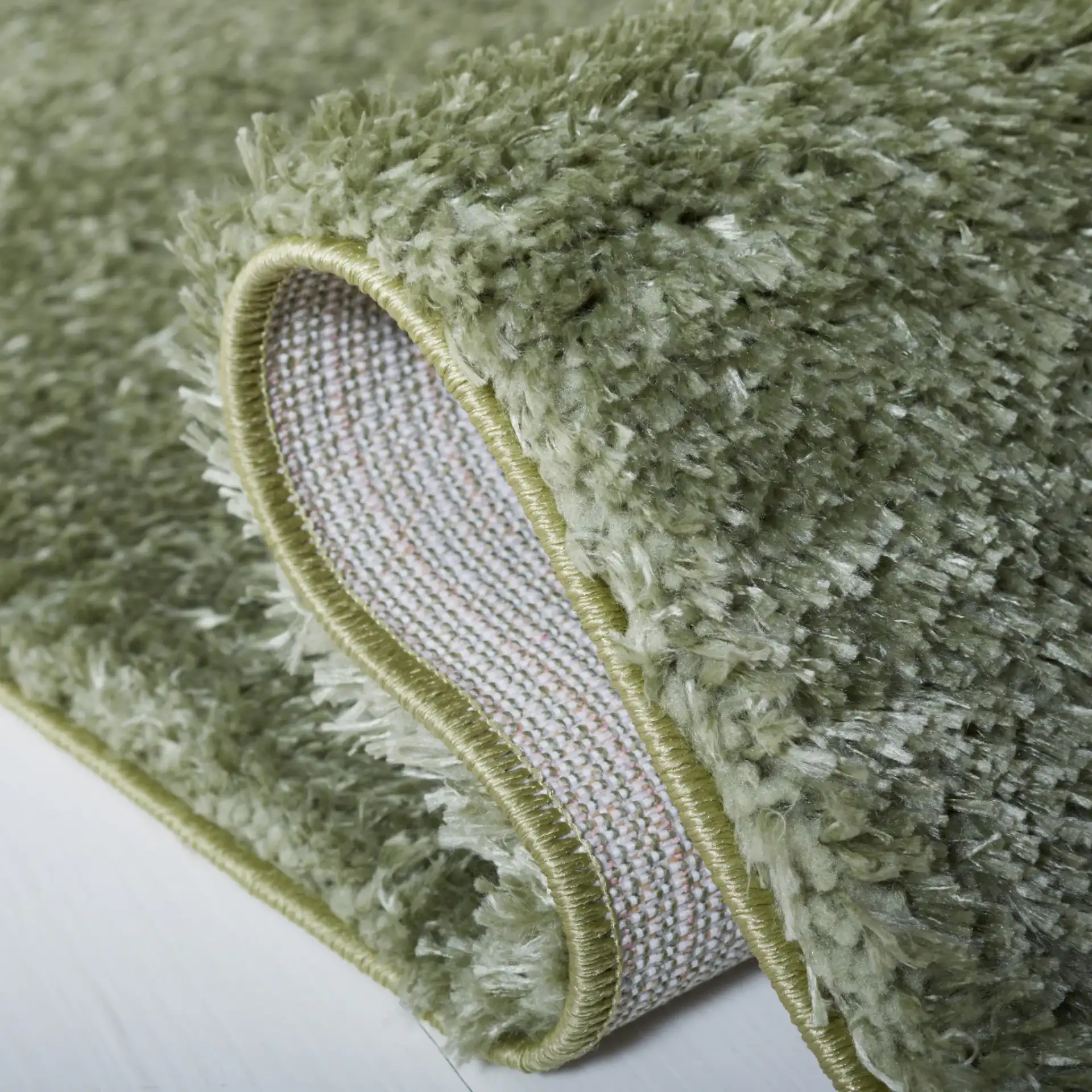 Tahoe Solid Shag Rug in Sage in a styled room