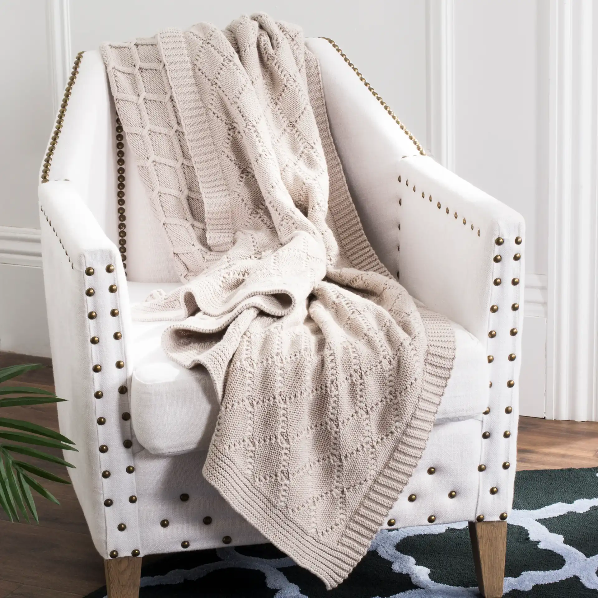 Petal Knit Throw in Palewisper in a styled room