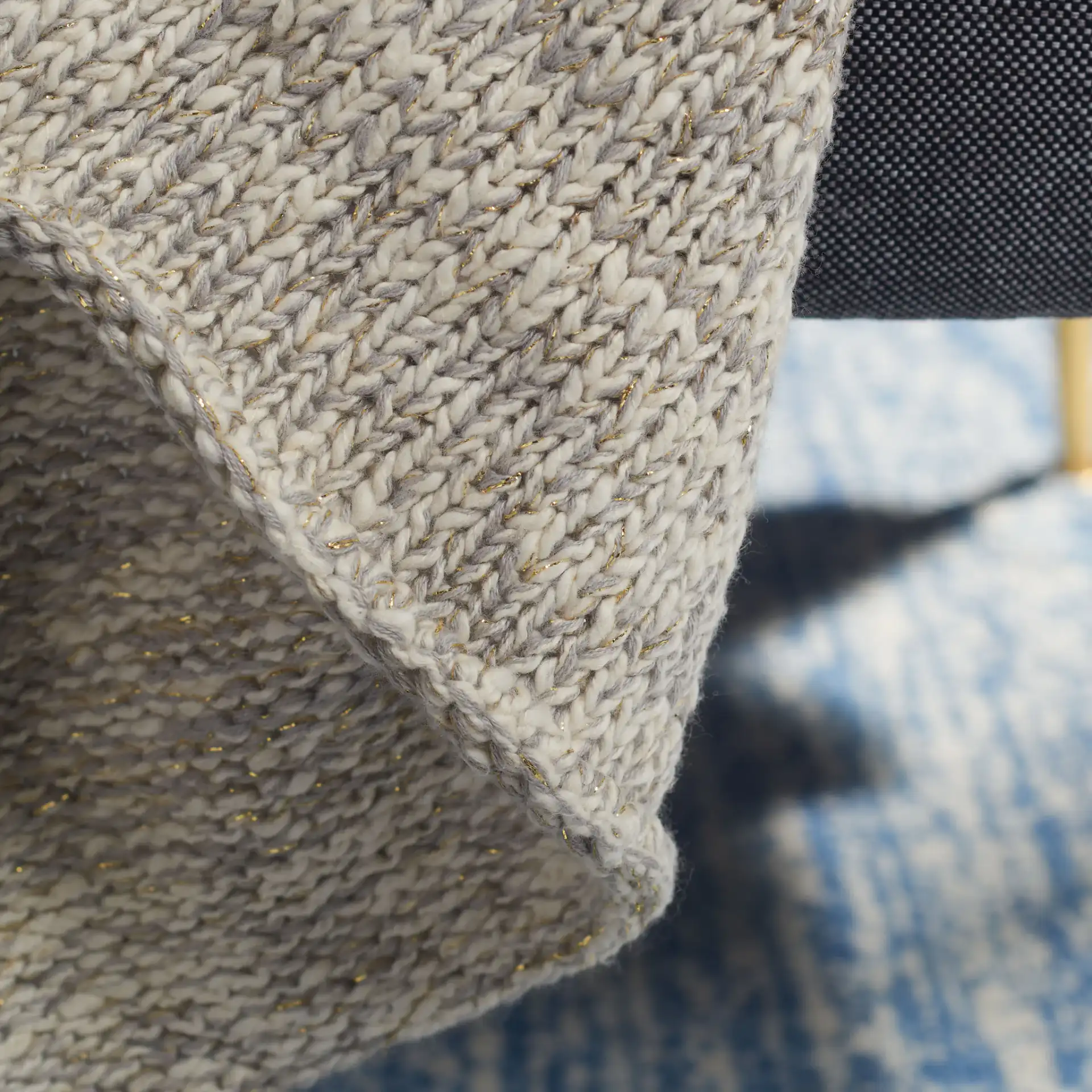 Panna Knit Throw in Gray in a styled room