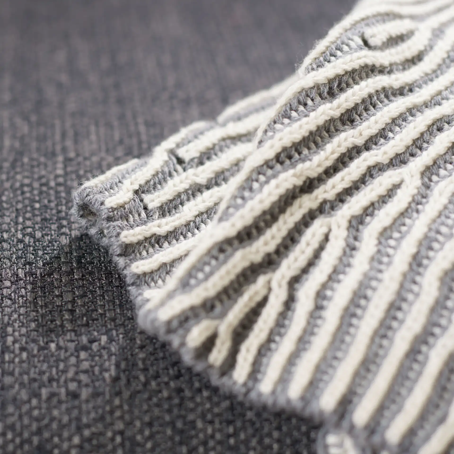 Kappa Throw in Gray / White in a styled room