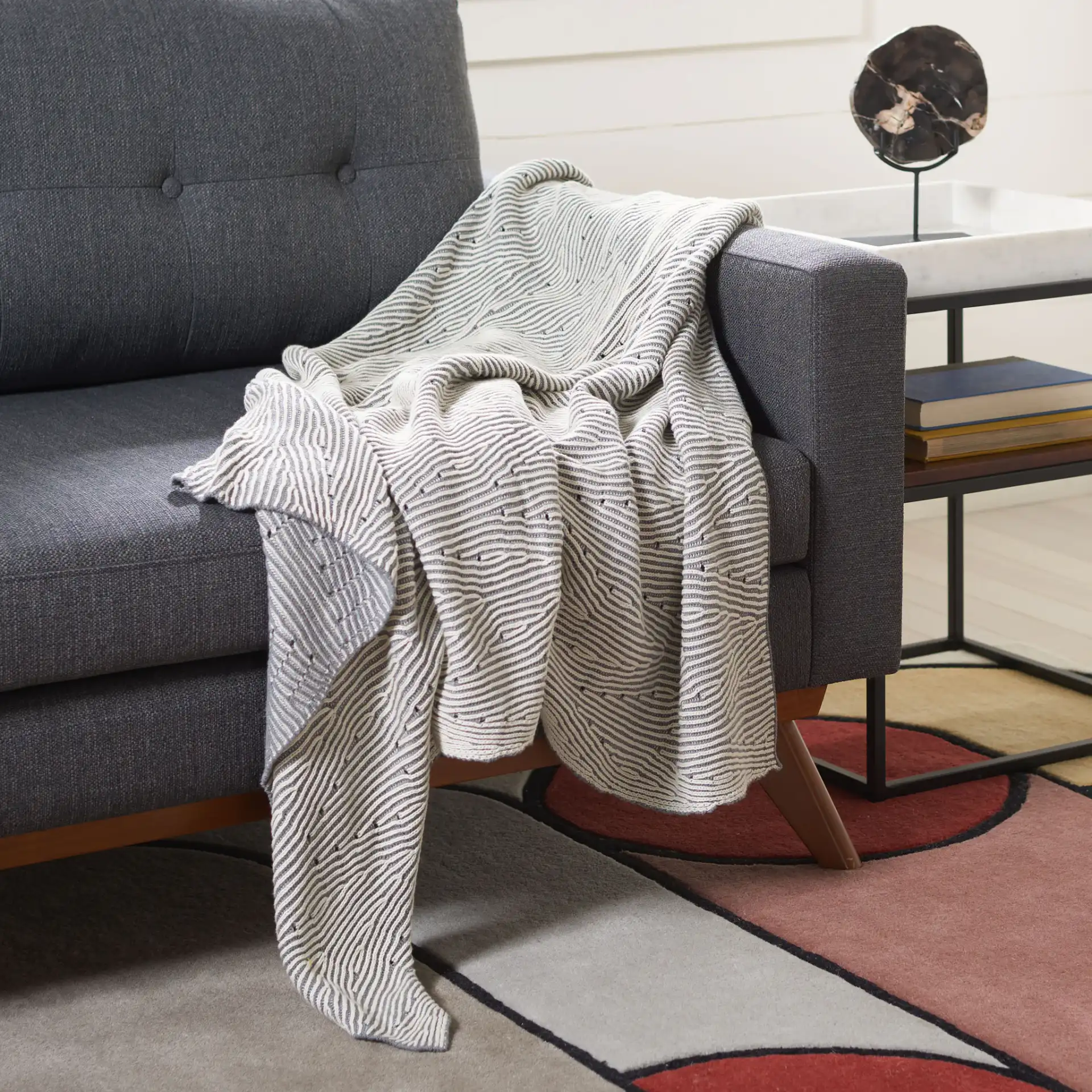 Kappa Throw in Gray / White in a styled room