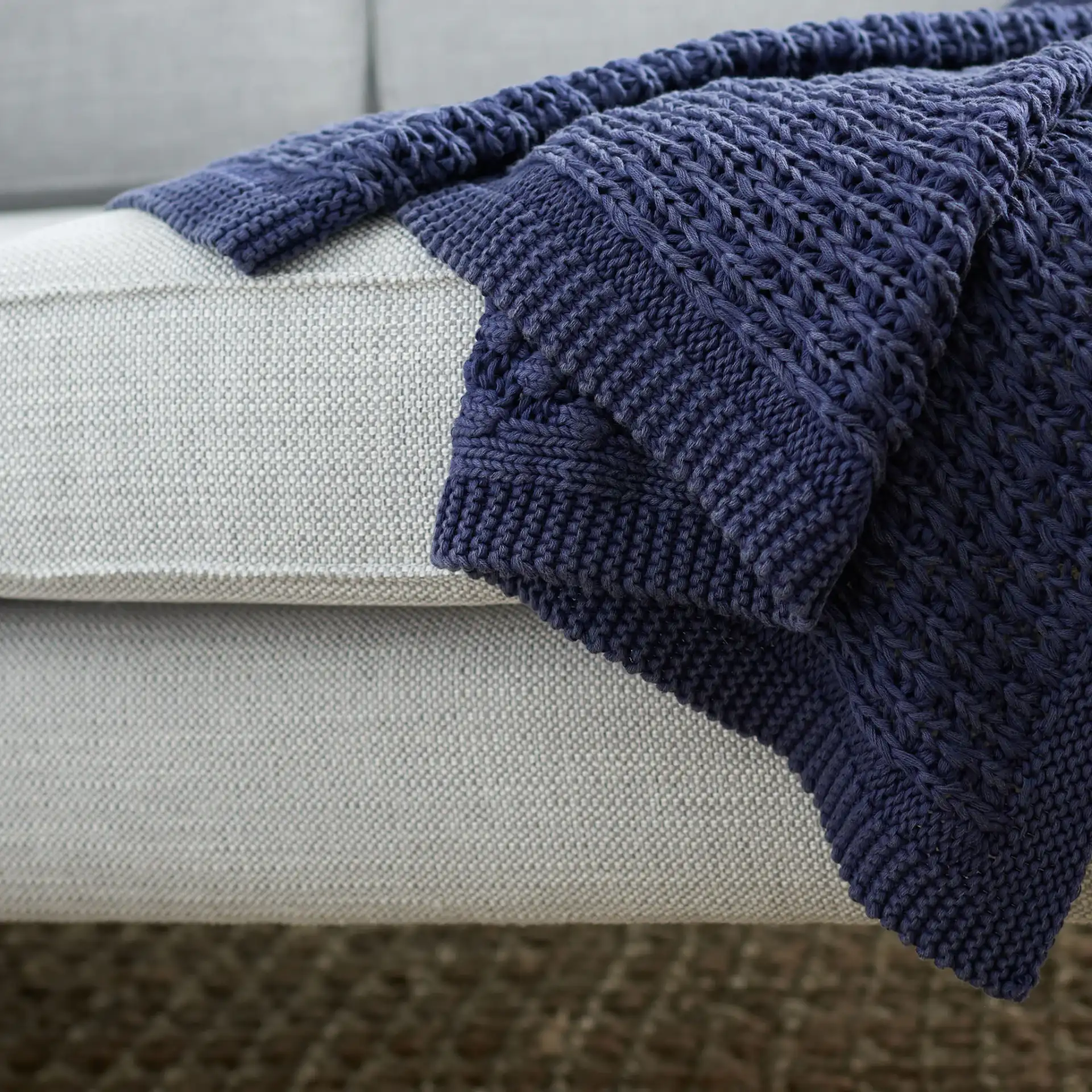 Larza Throw in Indigo in a styled room