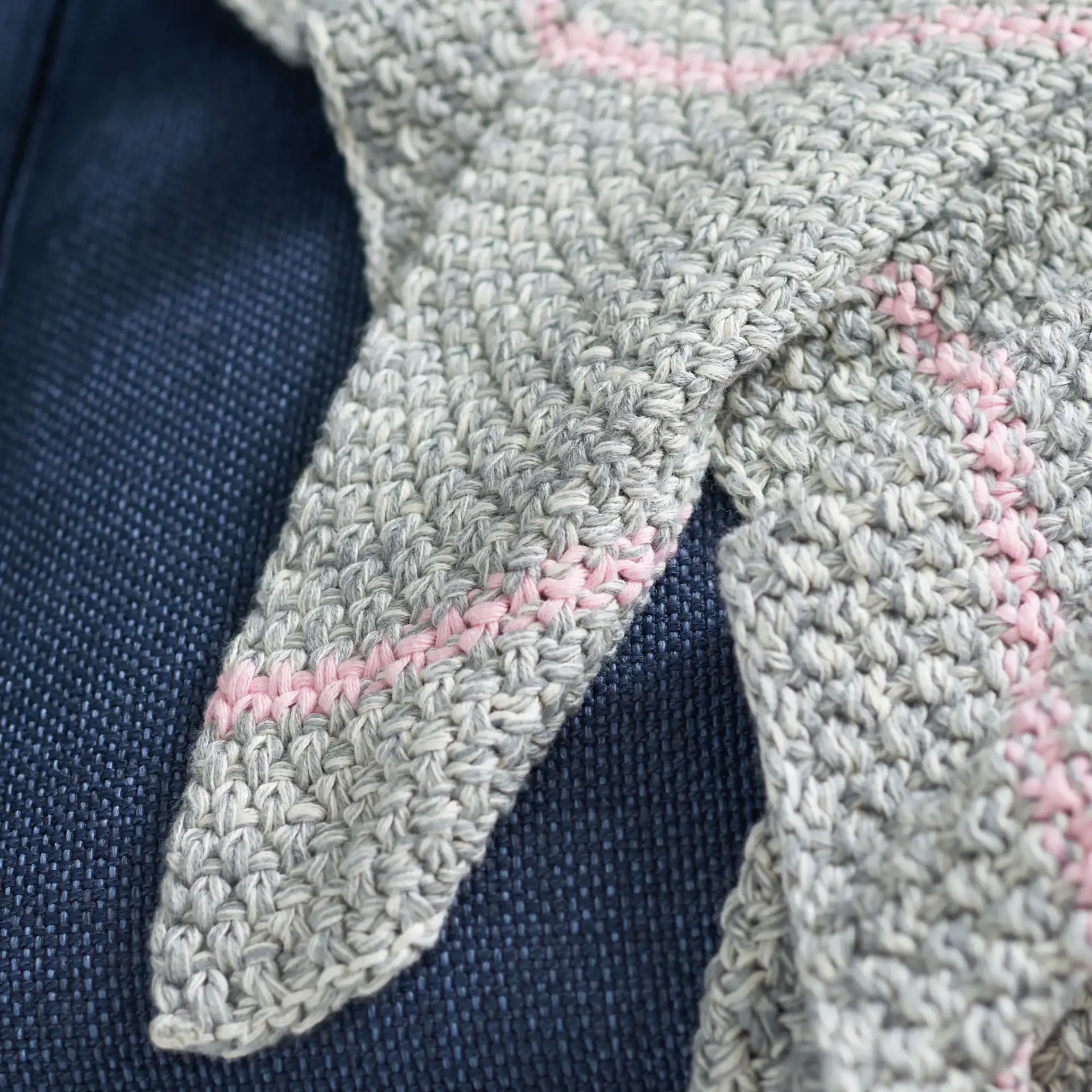 Cassian Throw in Pink / Gray in a styled room