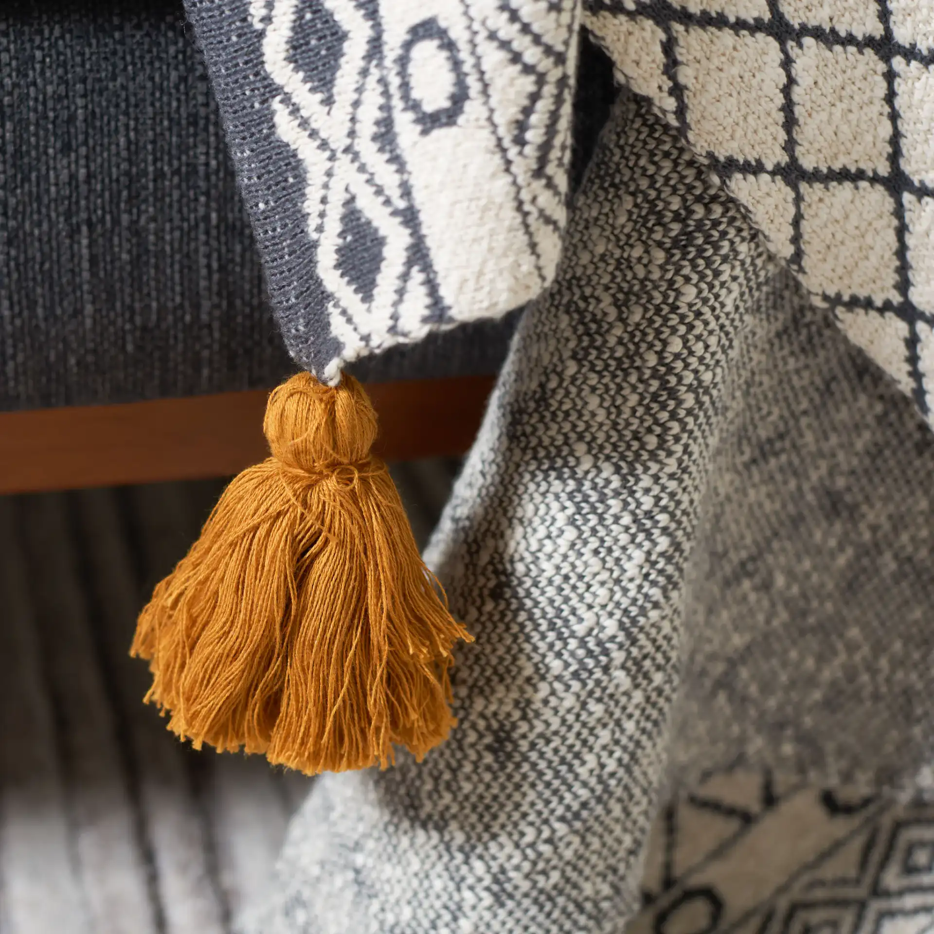 Ven Throw in Yellow / Black in a styled room