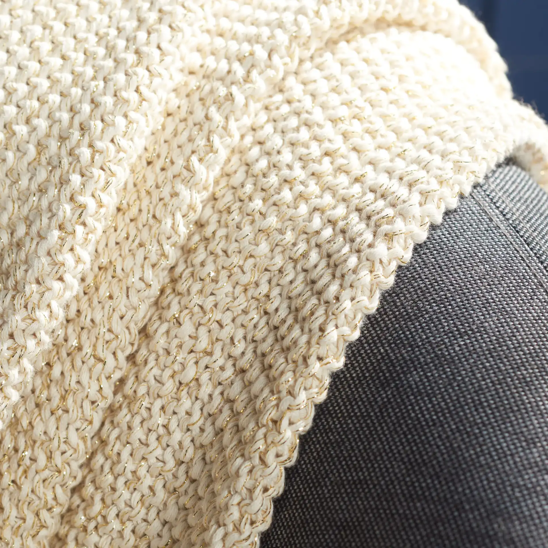 Mari Throw in Beige / Gold in a styled room